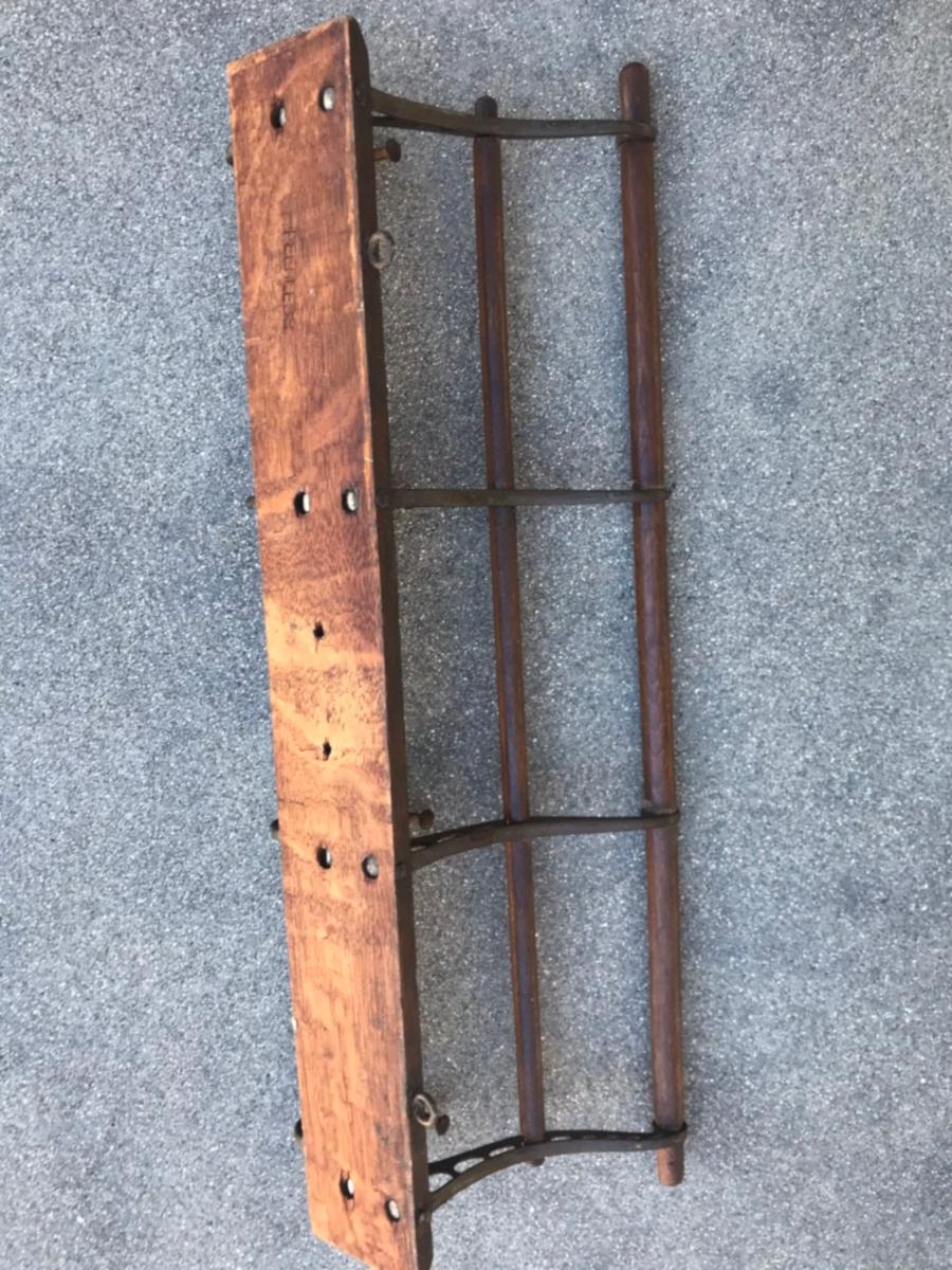 This funky hat and coat rack is in cast iron and wood and in very good condition. It is stamped Peerless hat and coat rack pat. Dated November 1901 Manufactured by Ubell W.W. Works, Indianapolis. Great for in a bathroom as well.