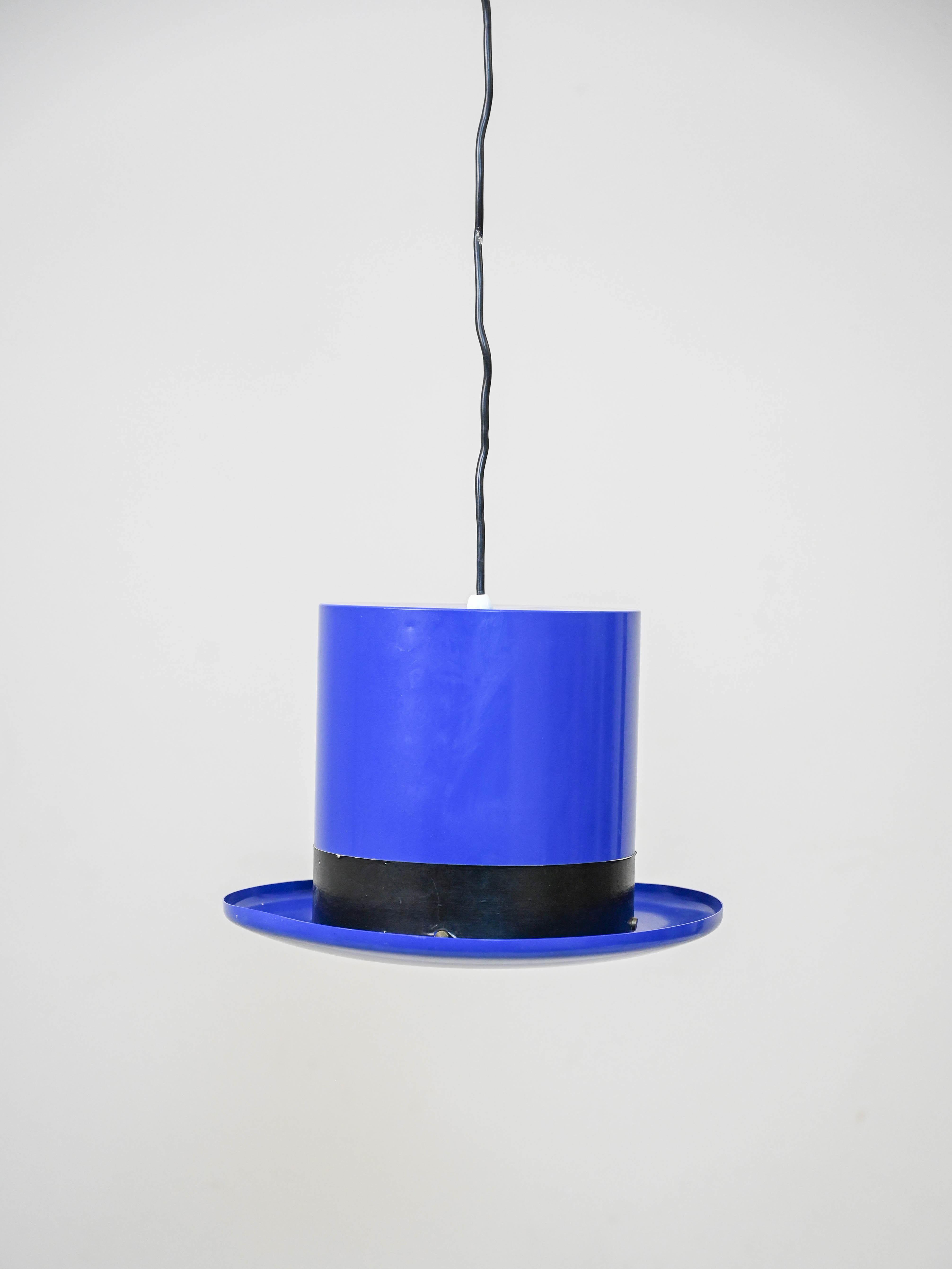 1960s Lamp by Jakobsson for Markaryd.

This iconic midcentury piece of furniture features a blue sheet metal shade with a distinctive hat shape. 
On the black cholere rim is the mark of authenticity.
Ideal for giving the room a refined and