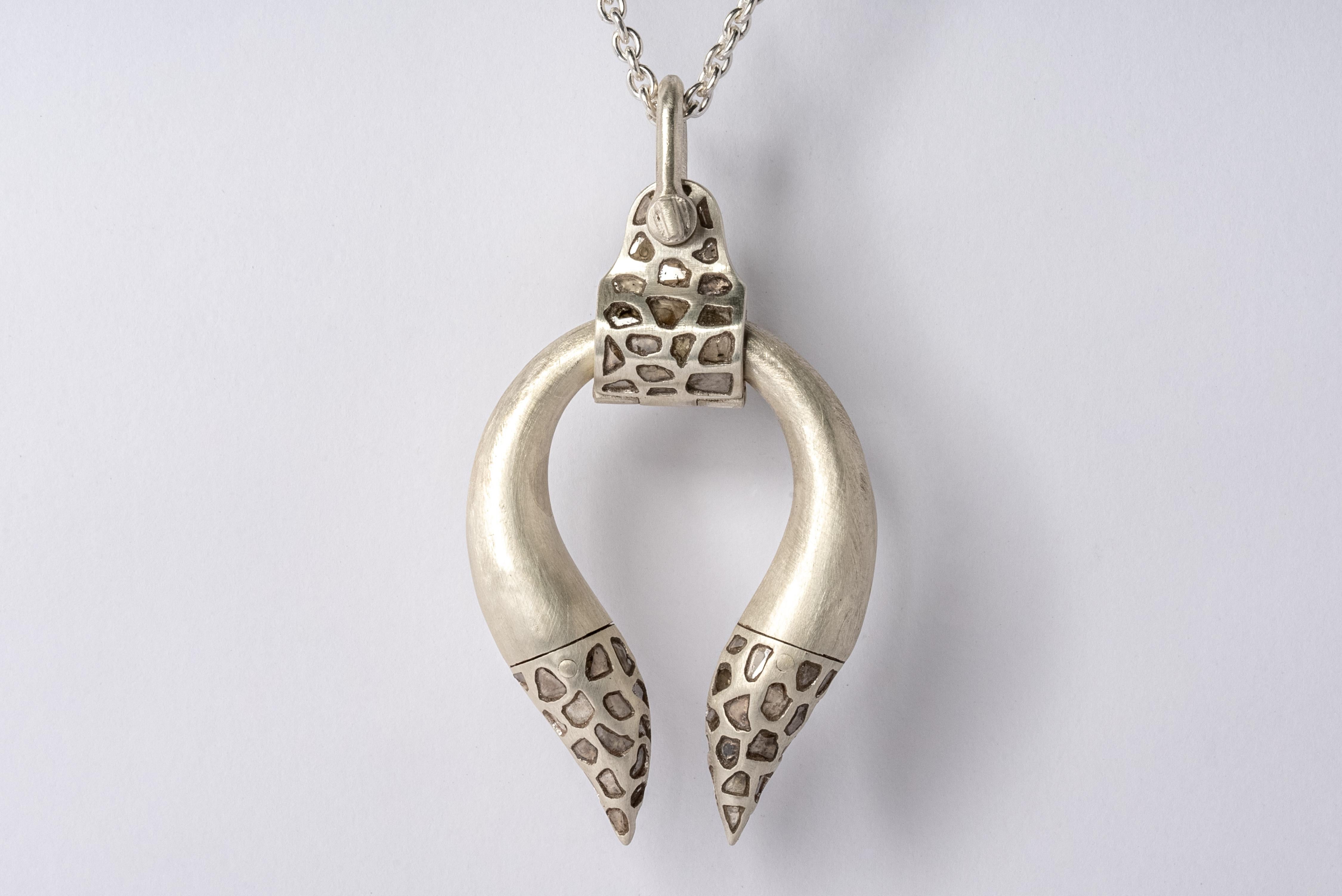 Pendant necklace in the shape of Hathor in sterling silver and slabs of rough diamond set in mega pave setting. These slabs are removed from a larger chunk of diamond, it comes on a 74cm chain. Each stone fragment and shape are absolutely unique,