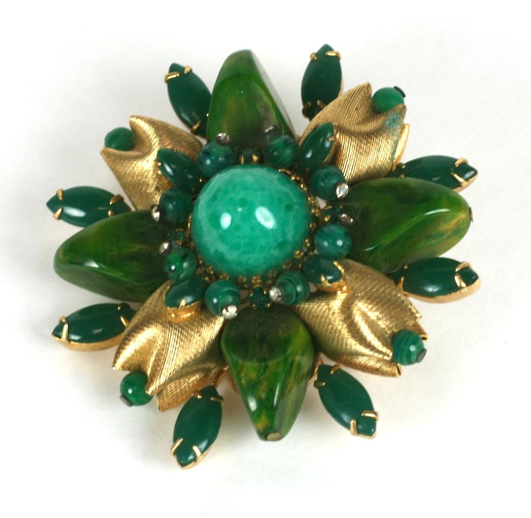 Wonderful and unusual Hattie Carnegie demi parure consisting of a large sunburst brooch and matching two strand necklace. Composed of gilt brass crimped textured beads and large green marbleized bakelite beads, pate de verre jade beads and small