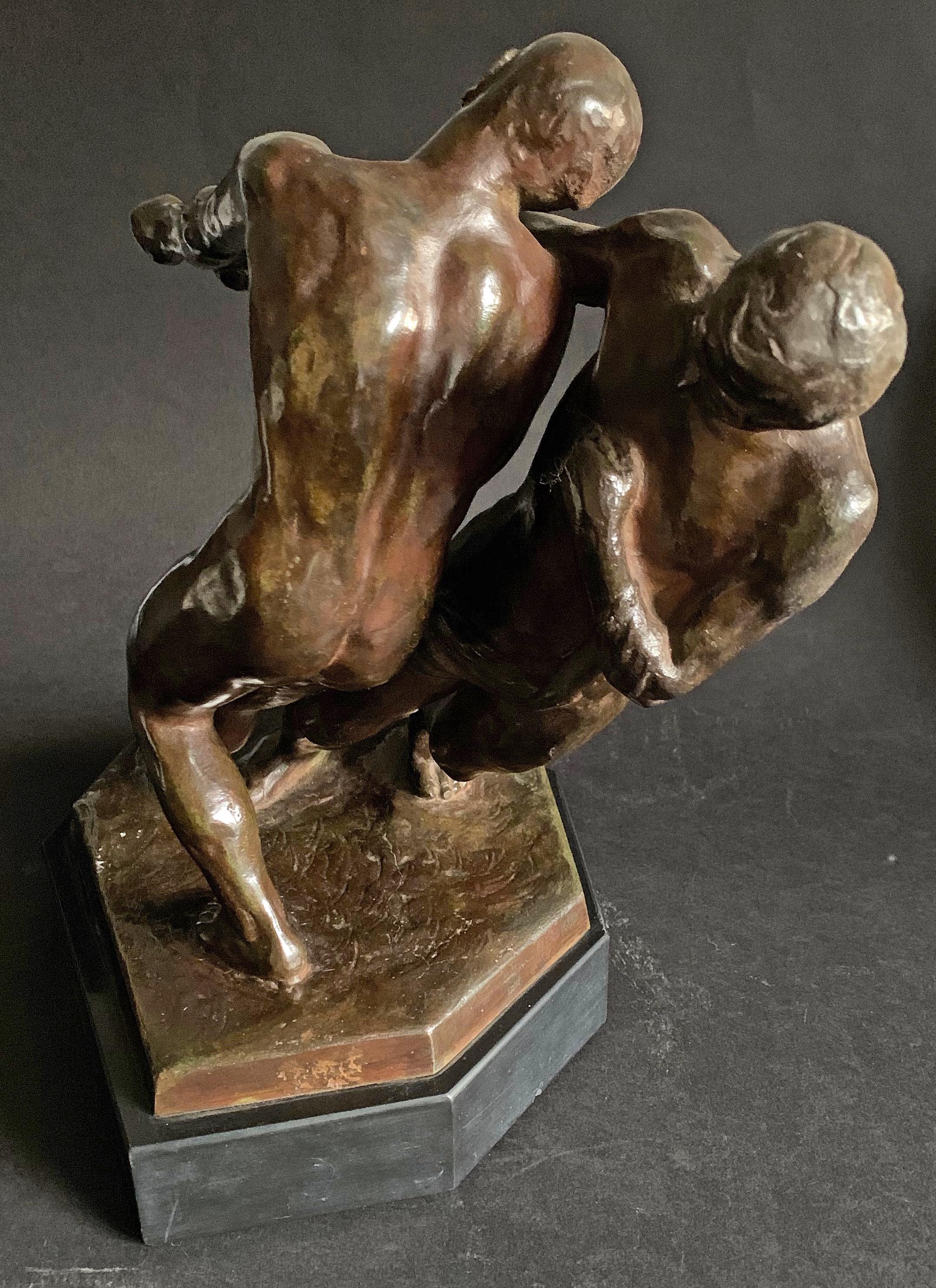 A rare and fascinating sculpture of two nude men hauling in something from a distance, this piece also serves as a fascinating study of the tangled relationship between two figures. They are posed as if they are dancing or wrestling -- in