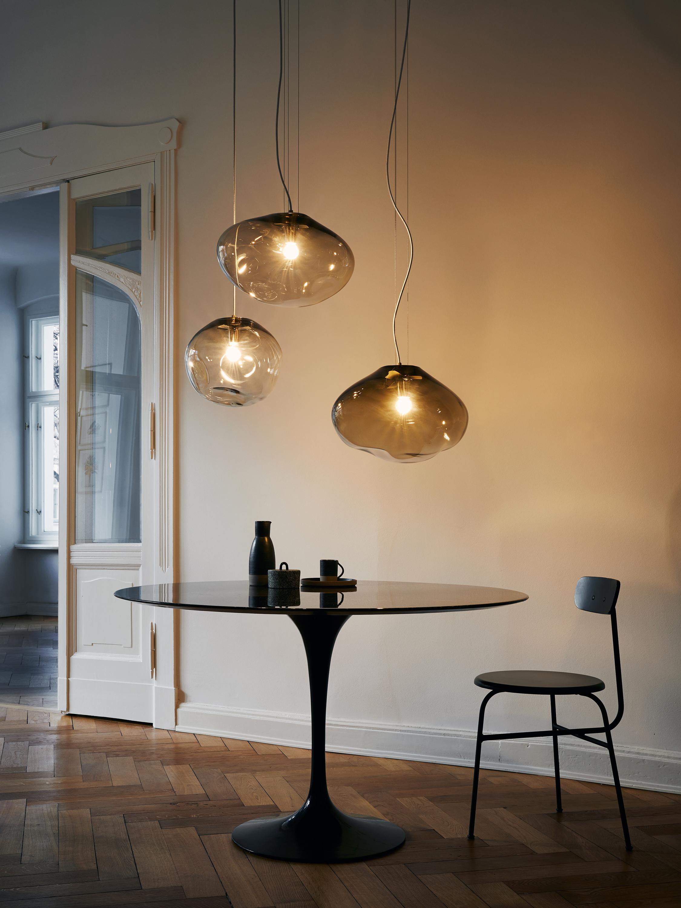 Solitary or in constellation, these lights create individual light concepts and associate with star constellations. 
Each glass piece is named after a star or a planet. 
They exist as hanging, floor, standing and wall luminaries.
The creator