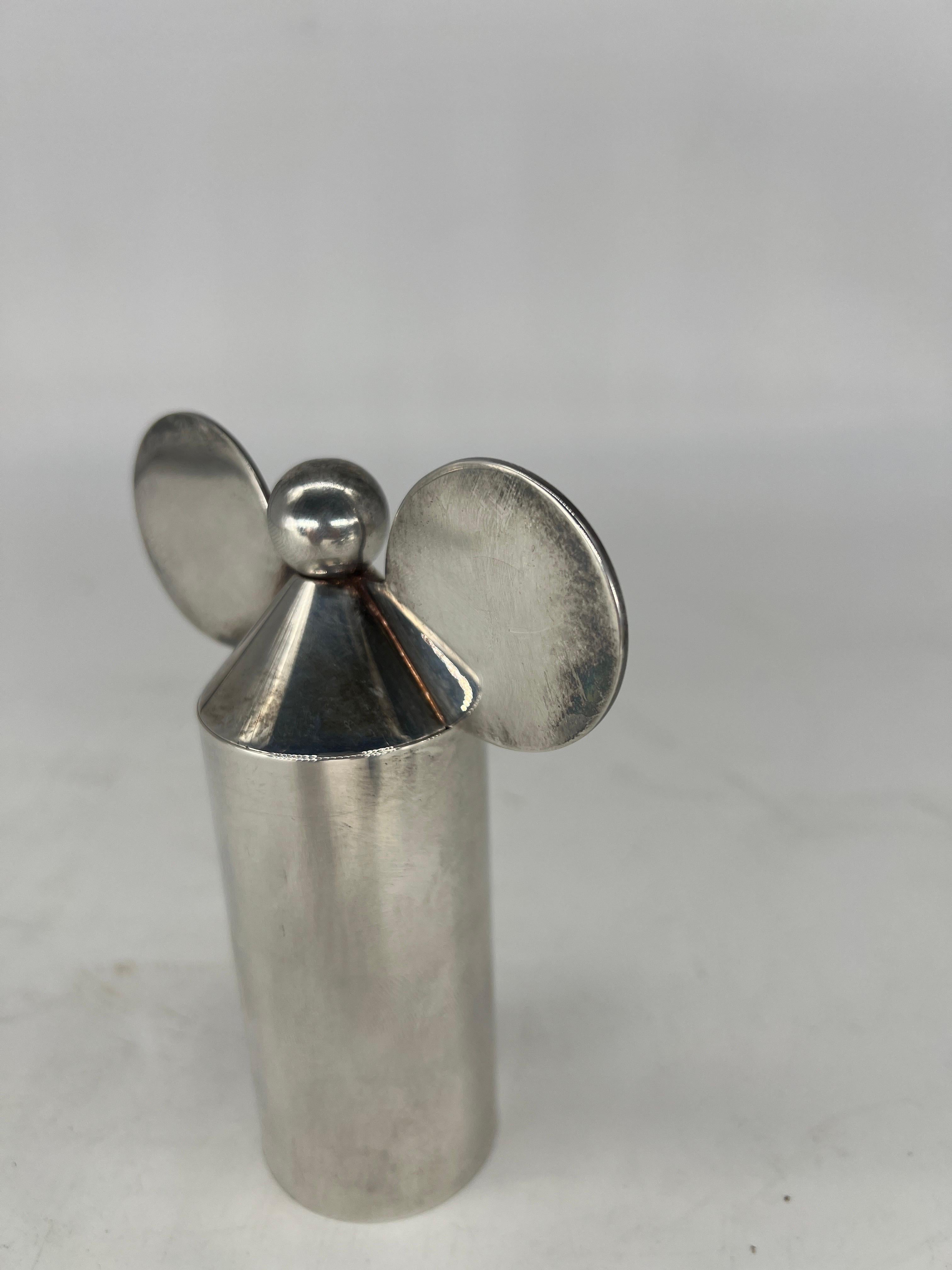 Designer: Robert and Trix Haussmann (1931 – present and 1933 -present) for Swid Powell (established 1982). 

A whimsical but important modern design, often described as the “Disney” pepper mill, but according to Tapert's book it 
