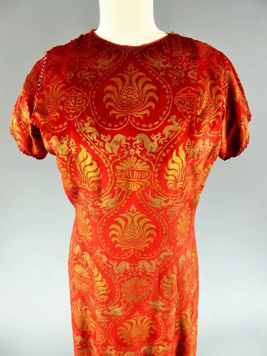 Circa 1930

France and Italy 

Long dress with gold velvet print attributed to Maria Monacci Gallenga. Famous patterns block printed on the velvet inspired by the Italian Renaissance and the fantastic Lucquois bestiary of the 14th century. Trace of