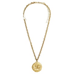 Vintage Haute Couture golden CC medallion