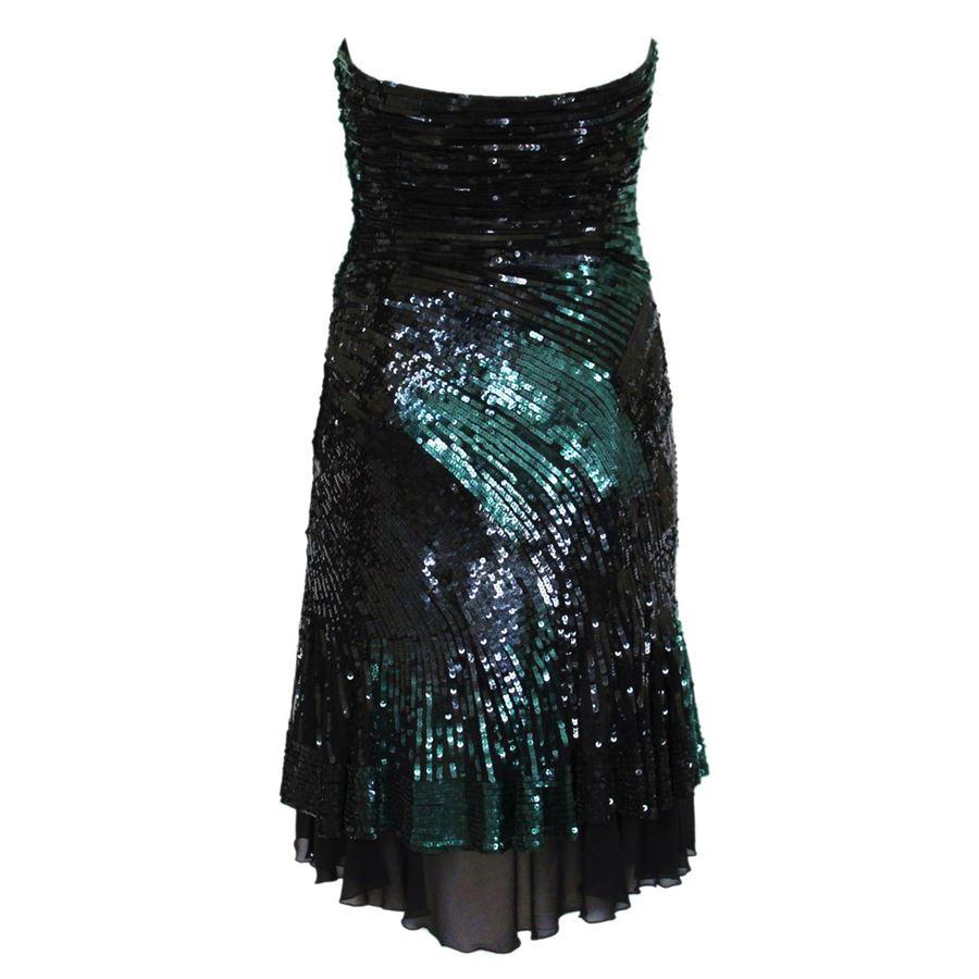 Haute couture Mixed fabric Black and green color Finely worked sequins inserts Lateral zip closure Total lenght cm 74 (29.1 inches) Original price euro 5000
