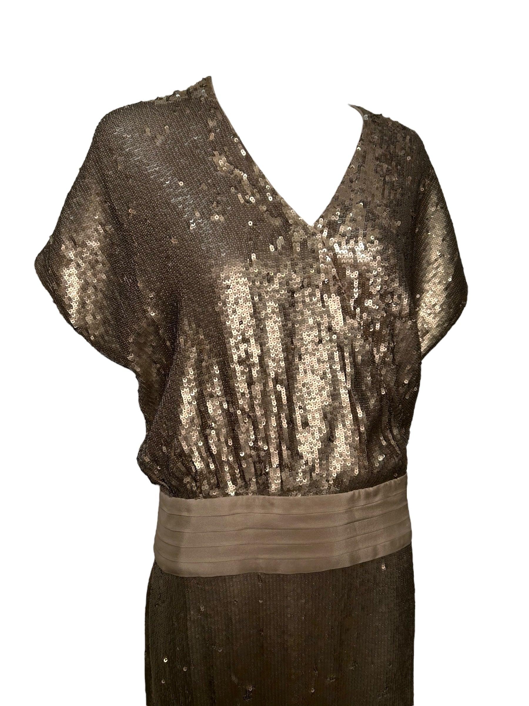 2000s Haute Hippie Sequin Gold Drop Waist Cocktail Dress.  Completely covered with gold sequins, this dress has a drop waist and a side zipper at hip/low waist with three snaps. One hook at chest.  Appears never worn.

Additional information:
Color: