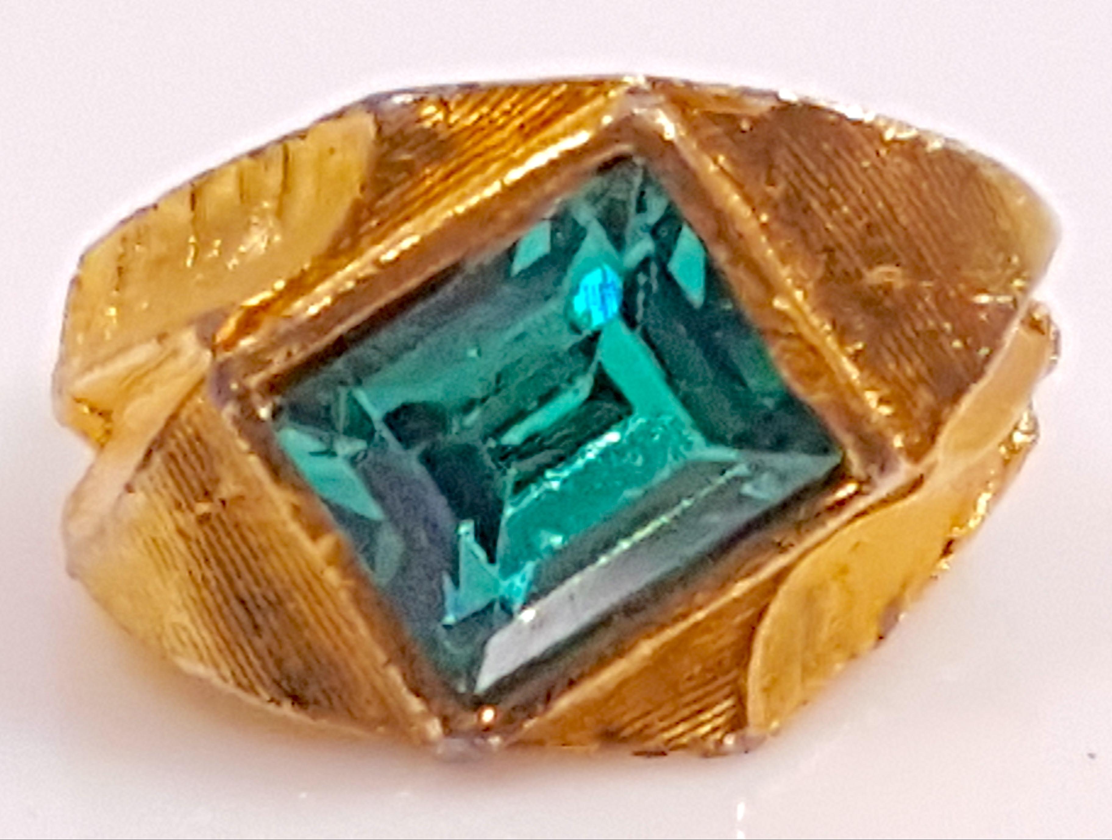 With an overlapping ring interior and textured exterior like raw silk that matches Christian Dior rings marked 