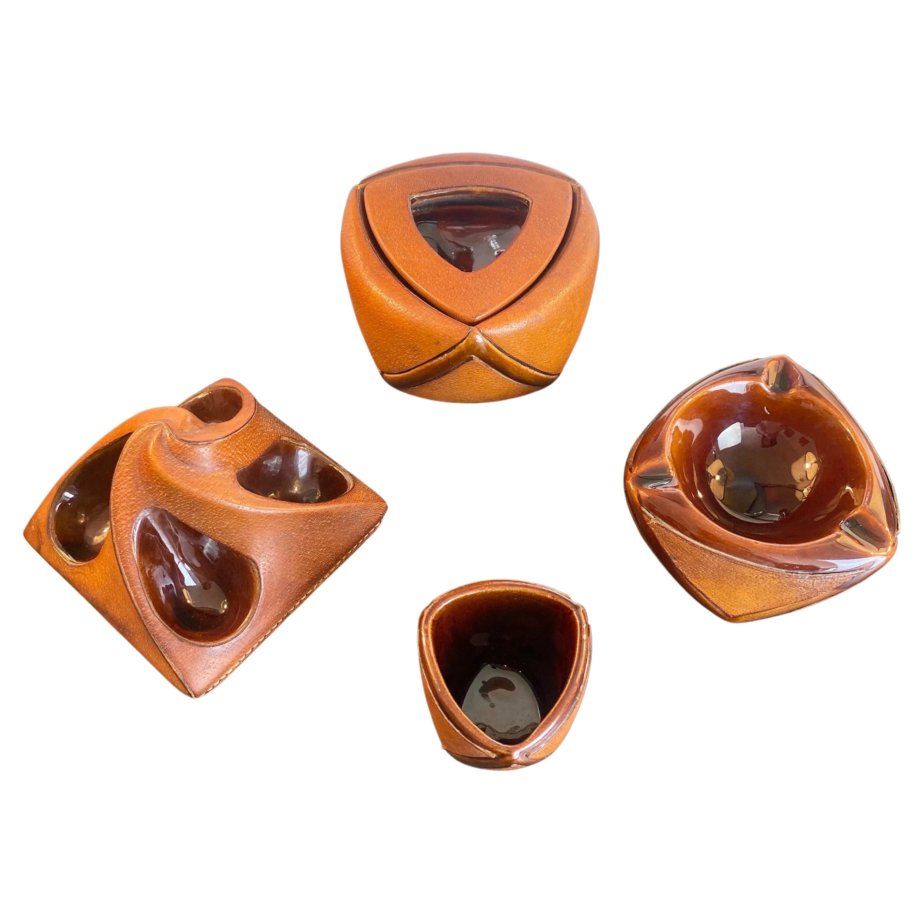 Smoker kit from the famous and luxurious Maison Longchamp.
Beautiful tan, camel, havana, brown color.
Comprising 4 pieces: an ashtray, a quadruple pipe holder, a tobacco jar and match jar.
Each piece is made of earthenware ceramic and brown