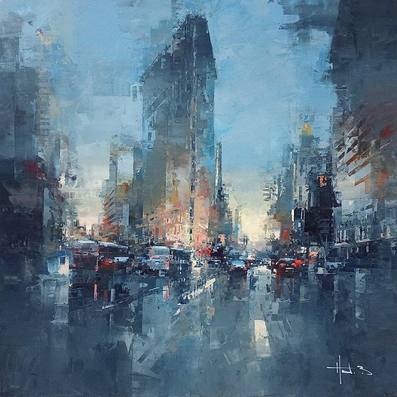 This piece, "Flat Iron Manhattan", is a 39.5x39.5 oil painting on canvas by artist Benoit Havard featuring a moody view from above bustling Manhattan, NYC. The flatiron building is in the background, and buildings in perspective line the street,