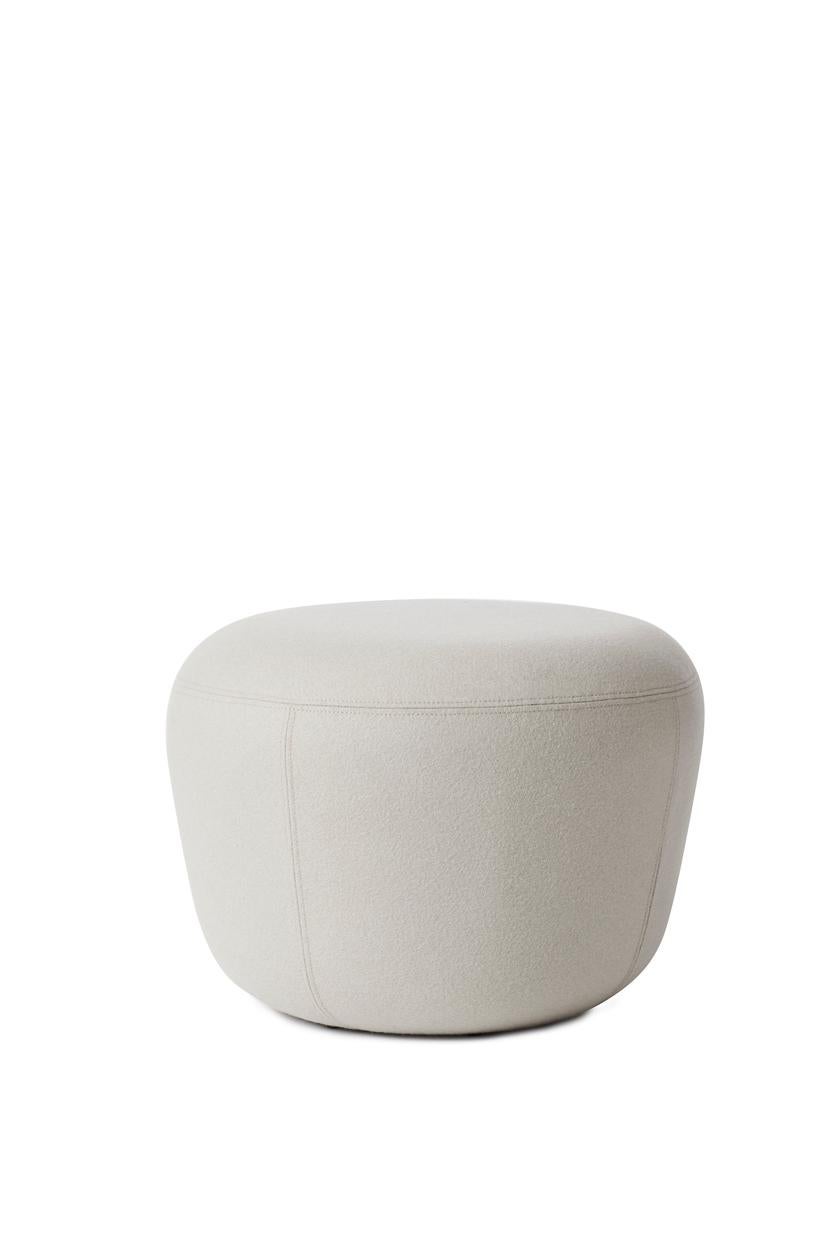 Haven cream pouf by Warm Nordic
Dimensions: D57 x H 40 cm
Material: Textile upholstery, Foam, Wood.
Weight: 9.5 kg
Also available in different colours and finishes. 

The Haven Pouf is a contemporary pouf with a simple, soft idiom. The Haven