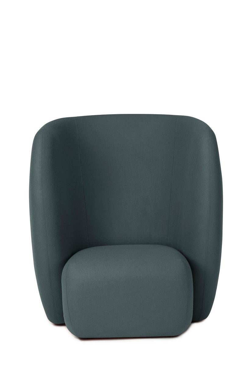Haven lounge chair Petrol by Warm Nordic
Dimensions: D107 x W84 x H 110 cm
Material: textile upholstery, foam, spring system, wood.
Weight: 50 kg
Also available in different colours and finishes. 

The Haven armchair is a contemporary chair