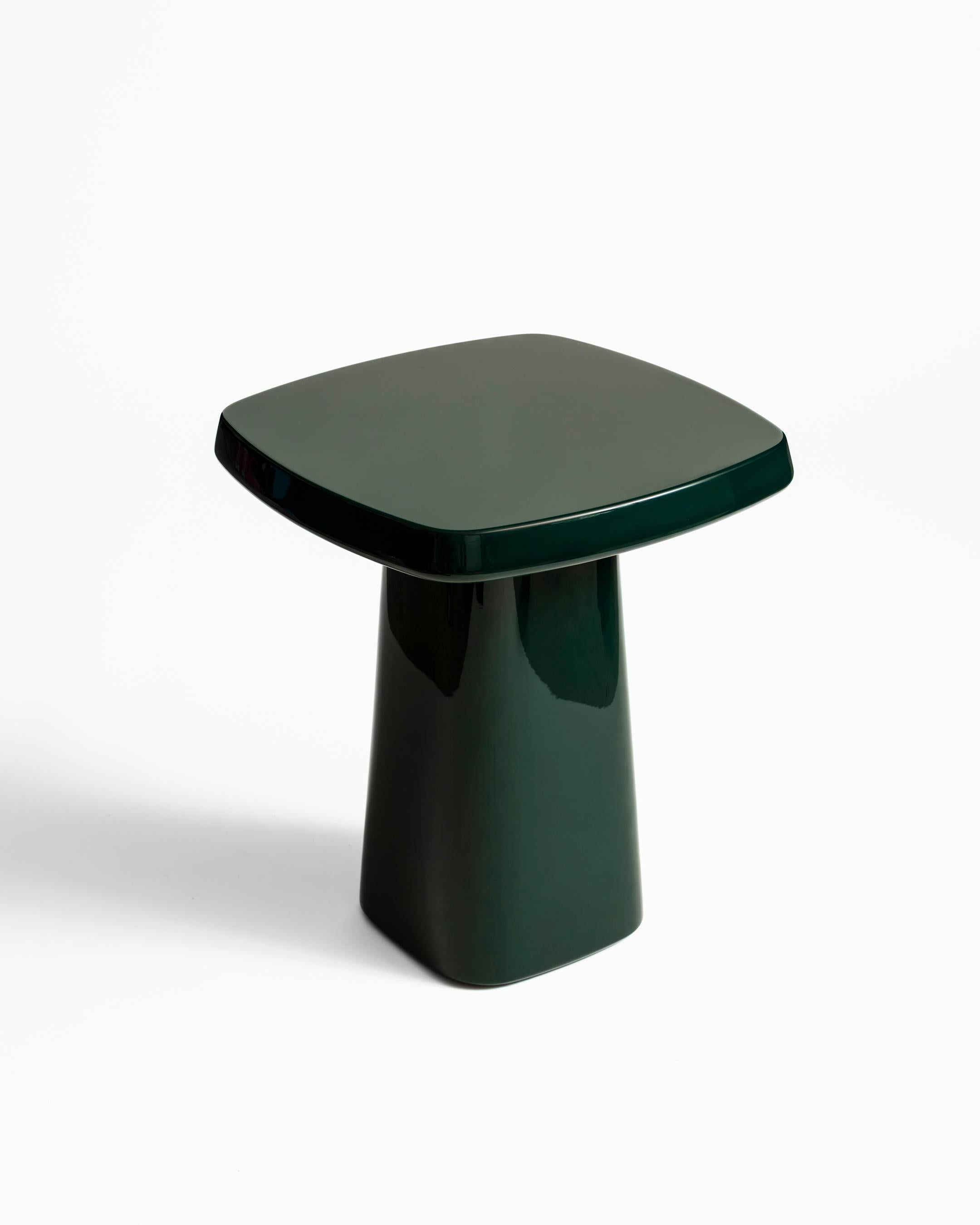High gloss lacquer side table with soft forms, perfectly proportioned to ground any setting. Features a powder coated aluminum mounting plate and inset cork floor pad.

Shown in British Racing Green high-gloss lacquer.

Dimensions
15″W x 15″D x