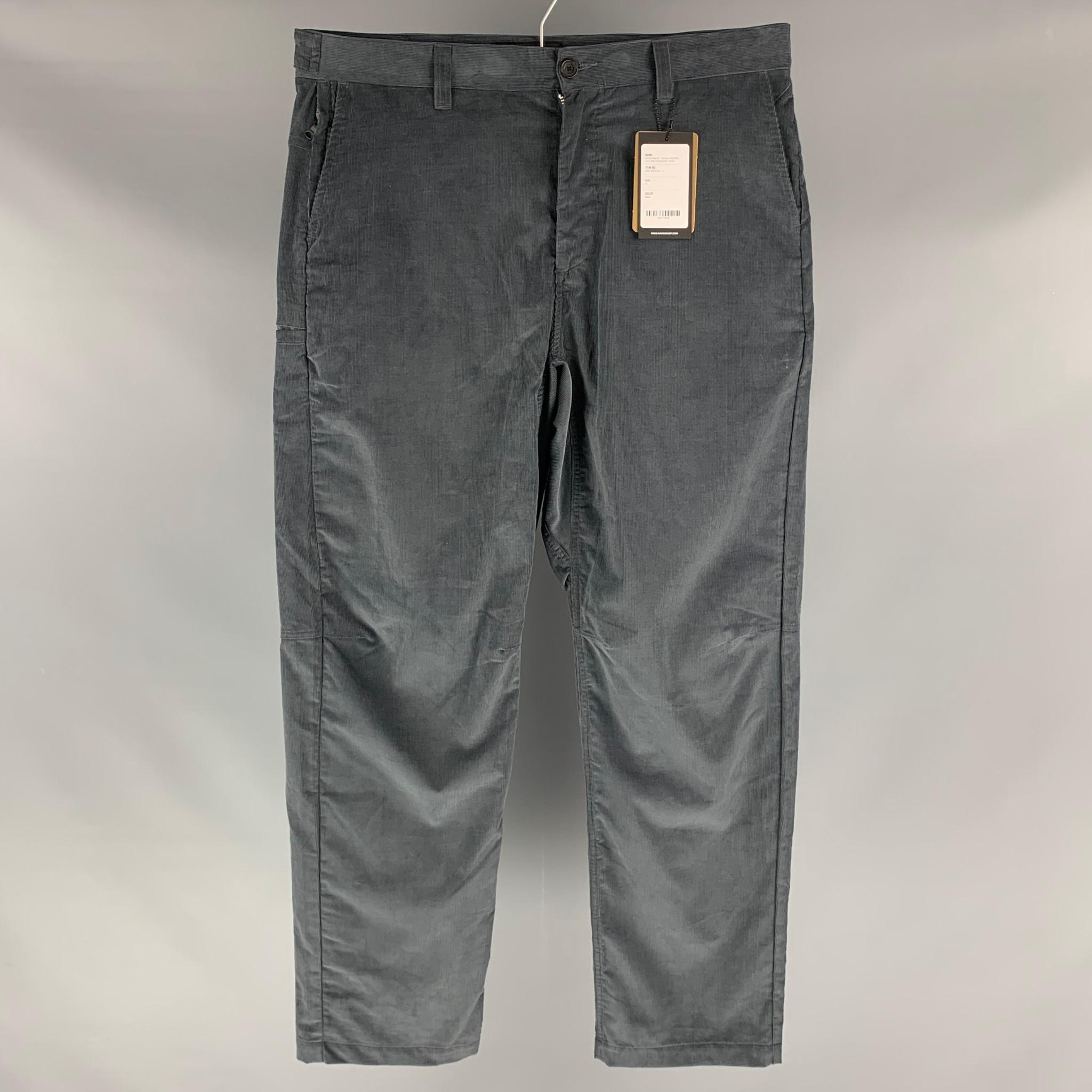 HAVEN 'Opus Pants' casual pants comes in a grey cotton corduroy fabric featuring a slate style, a zip up pocket, a lateral pocket, snap button detail at waistband and a button fly closure. Made in Canada.

New With Tags.
Marked: