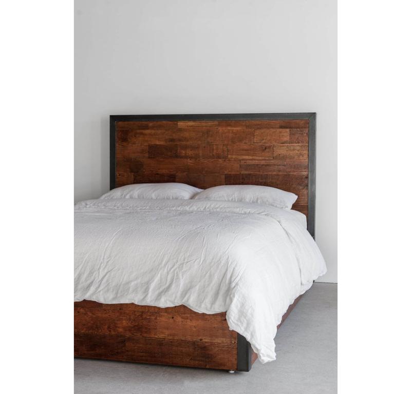 The Havenhurst Bed from features a unique patchwork design that combines reclaimed Douglas fir in varying tones and textures with industrial steel trim. The steel trim adds a touch of modernity to the rustic charm of the reclaimed wood, making it a