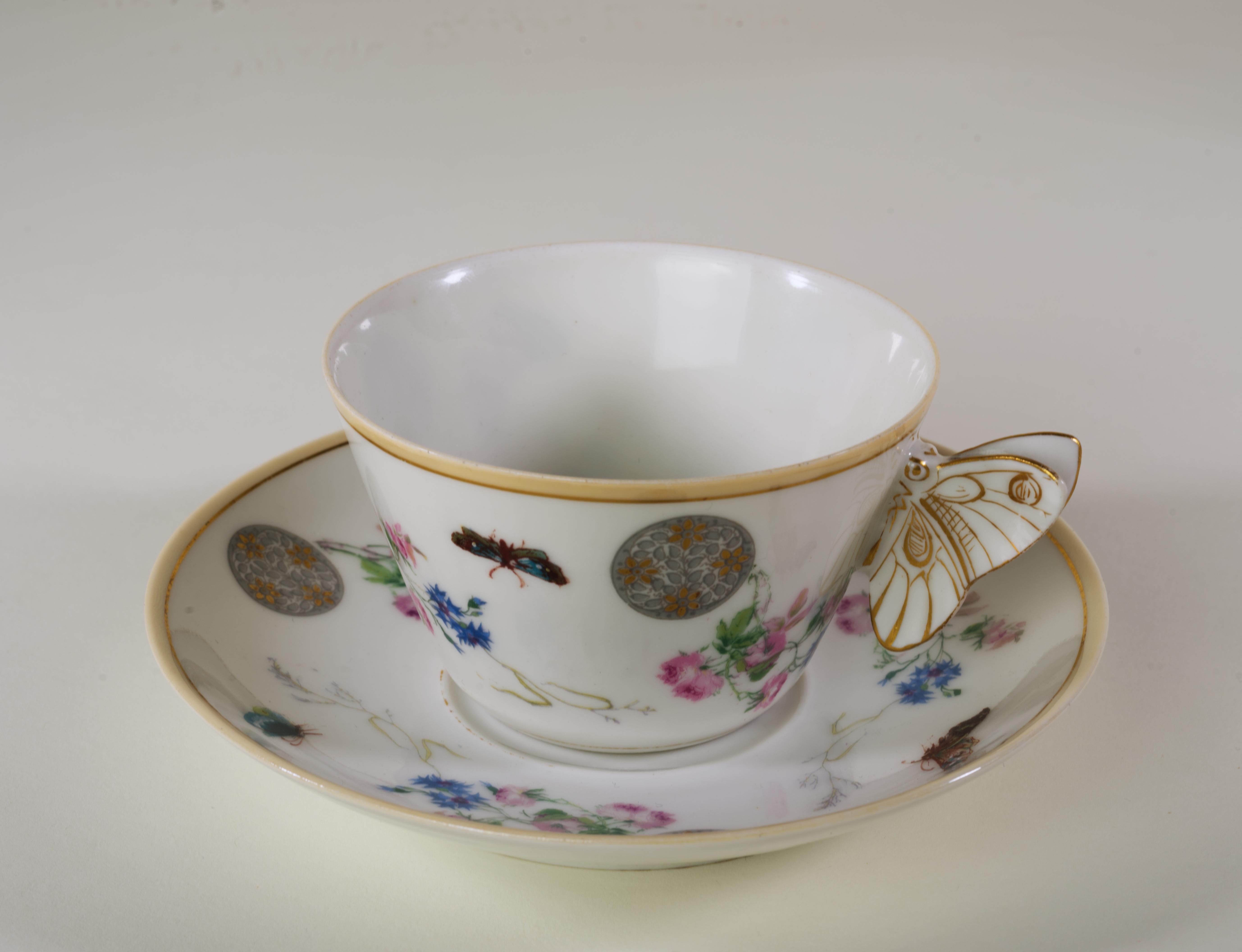  Cup and saucer set by Haviland & Cie is decorated in Aesthetic style, combining elements of 3 different patterns. Meadow Visitors butterflies, placed between Bracquemond style sprays of pink roses and blue cornflowers, are accentuated with grey and