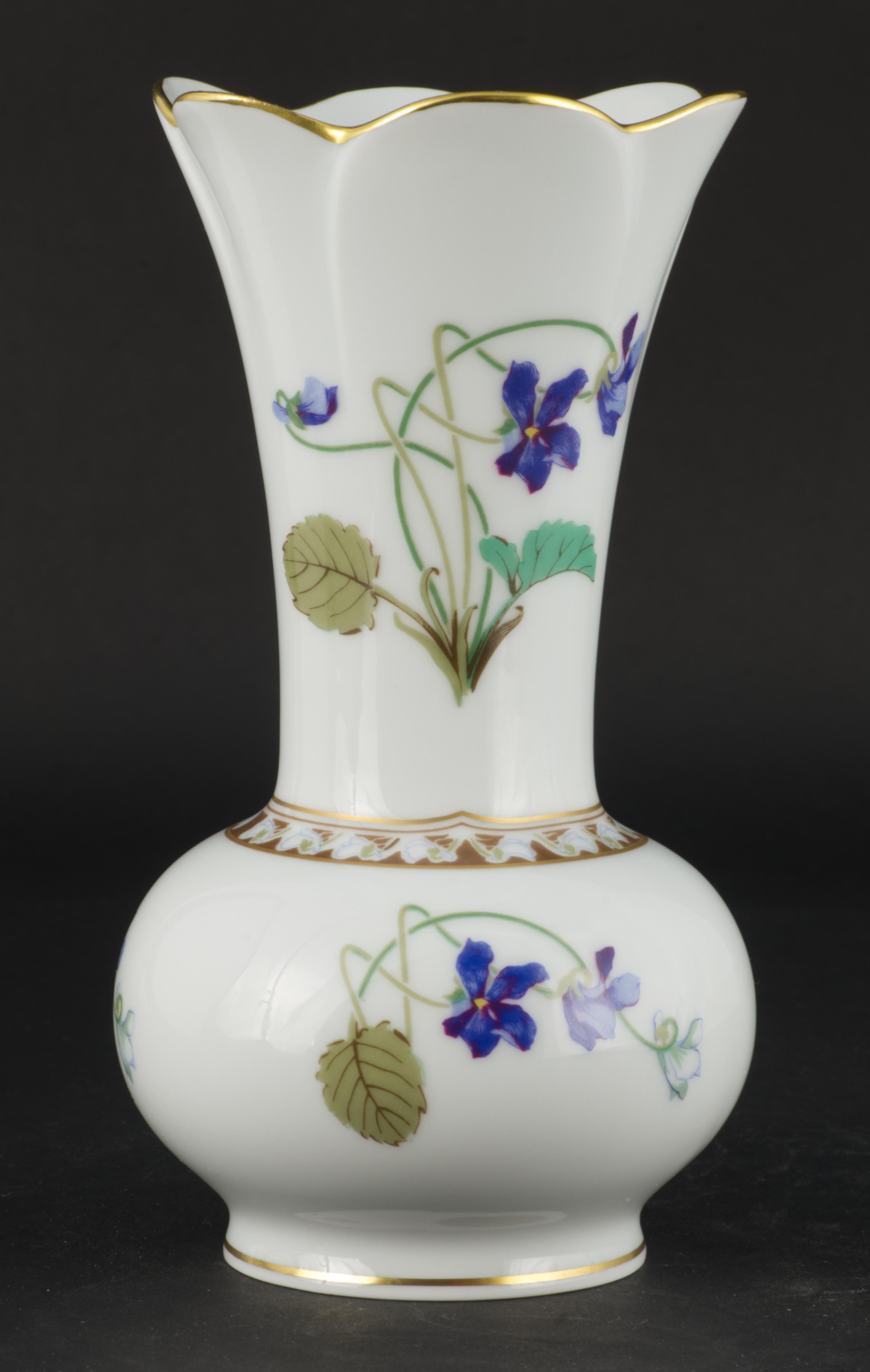
Haviland Limoges France vase in Imperatrice Eugenie pattern is made on one of the discontinued blanks and is probably one of the first vases decorated in this iconic pattern. 

Originally the pattern was created by Theodore Haviland for the Empress