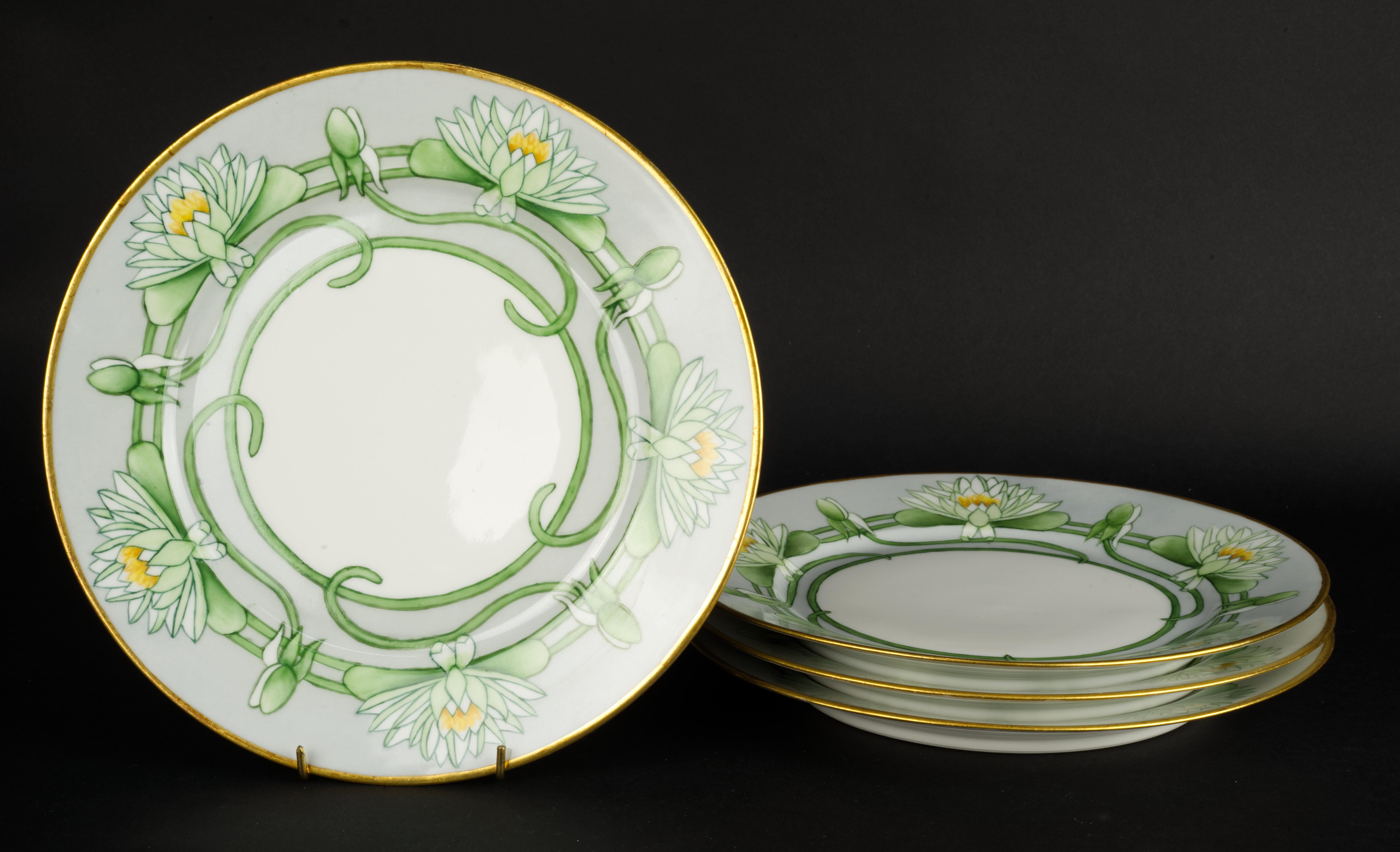  Set of 4 unique, antique plates was made by Haviland & Cie in Limoges, France. The plates were hand painted by a professional artist in a decorating studio with Art Deco motif of five water lilies on pale blue background. Calm blue and green colors