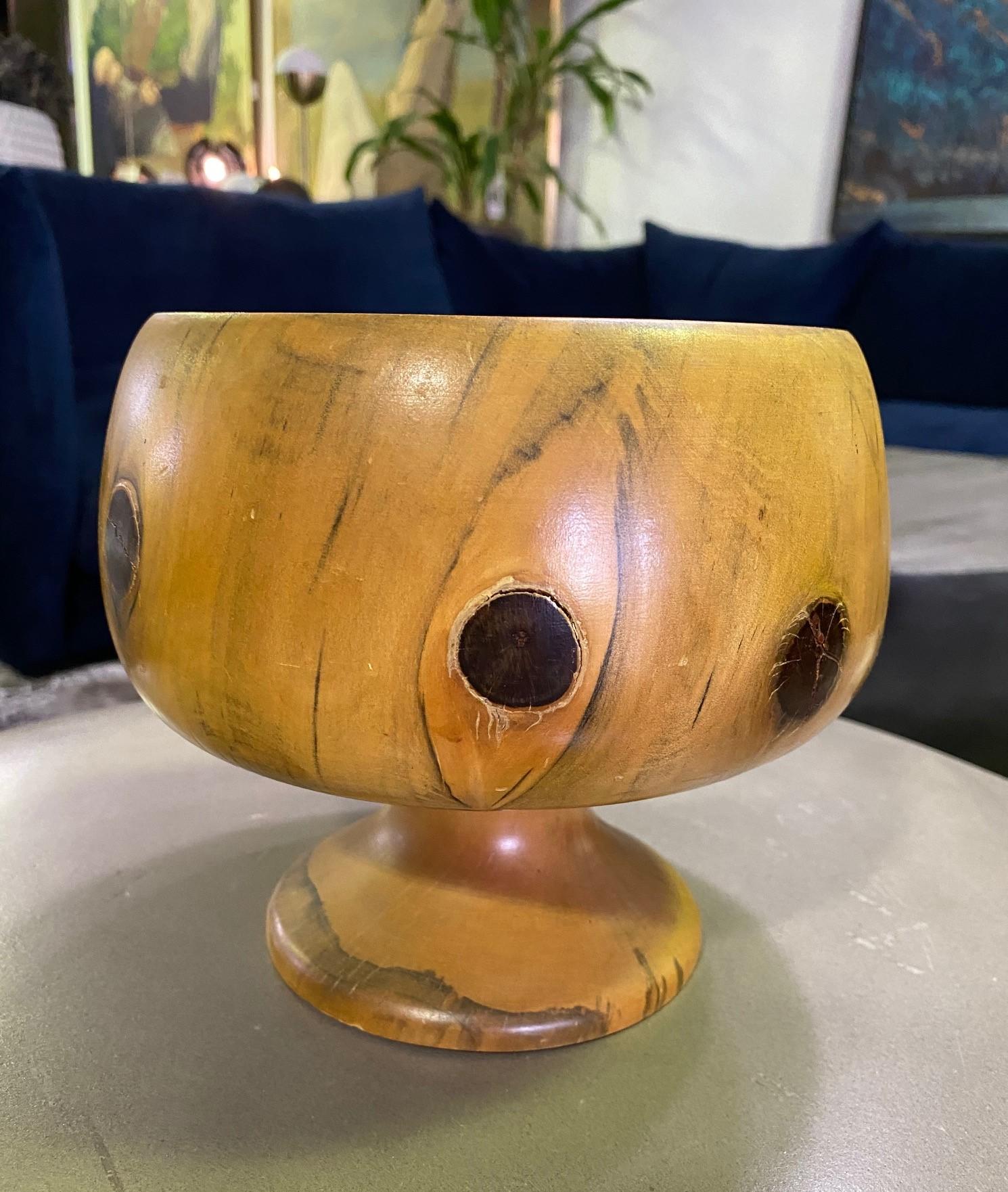 A wonderfully designed and unusually shaped wood-turned vessel / sculpture / chalice. Very well crafted. 

Noted: 