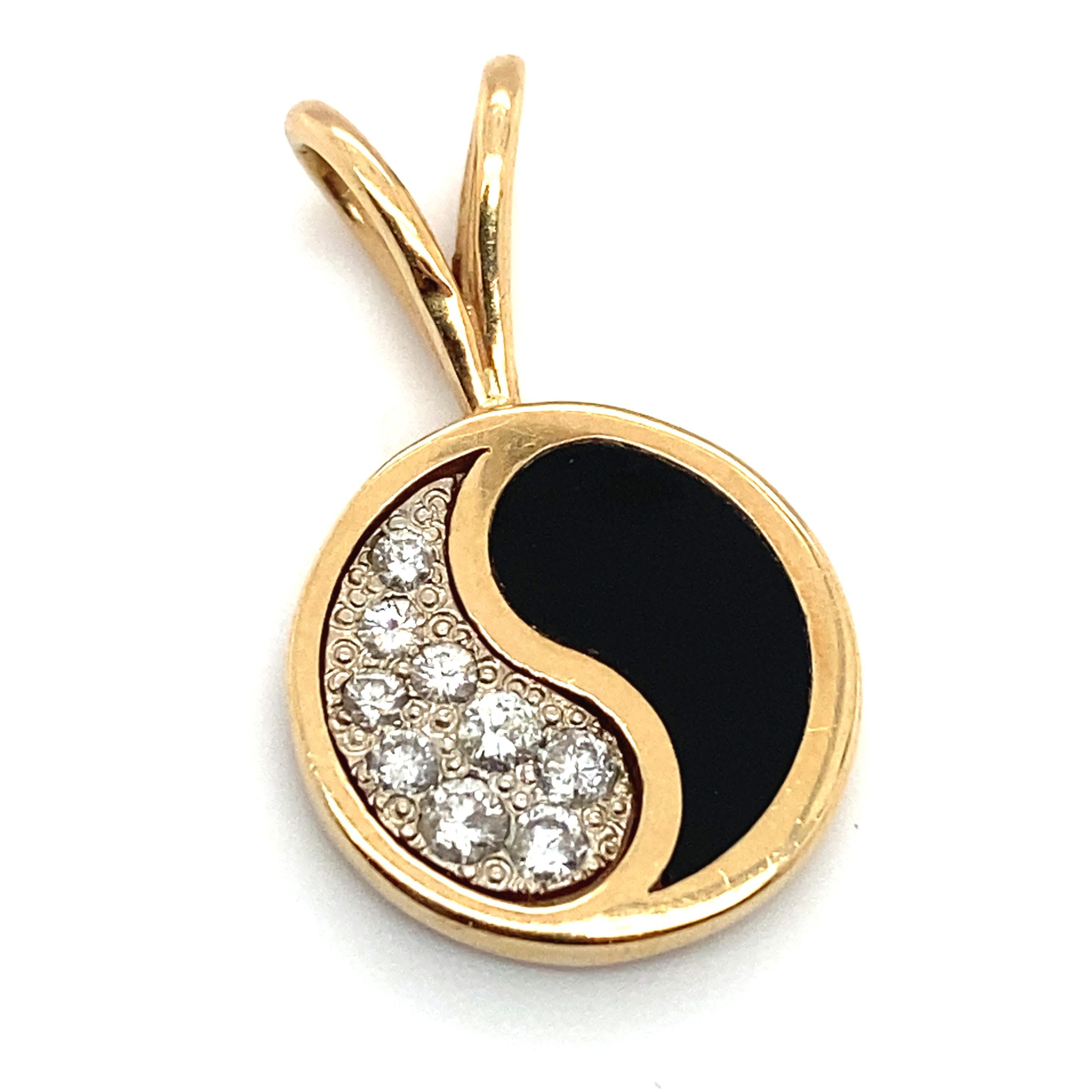 Item Details: This unique yin-yang pendant features black coral and diamond accents and is made in Hawaii.

Circa: 2000s
Metal Type: 14 Karat Yellow Gold
Weight: 4 grams
Size: 1 inch Length 

Diamond Details:

Carat: 0.25 carat total weight
Shape: