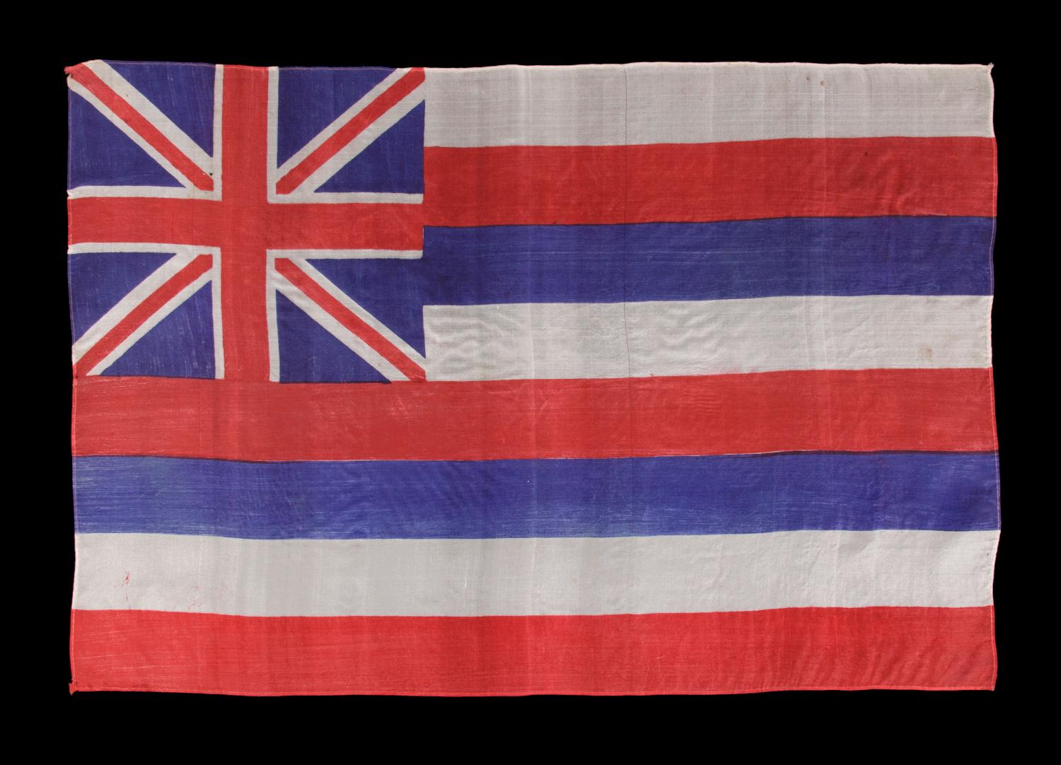 HAWAIIAN PARADE FLAG, CA 1893-1920's, PRE-STATEHOOD, A RARE EXAMPLE IN THIS EARLY PERIOD 

Hawaiian parade flag, printed on silk, made sometime in the period between 1893 and the 1920's. Parade flags were affixed to wooden staffs and intended for