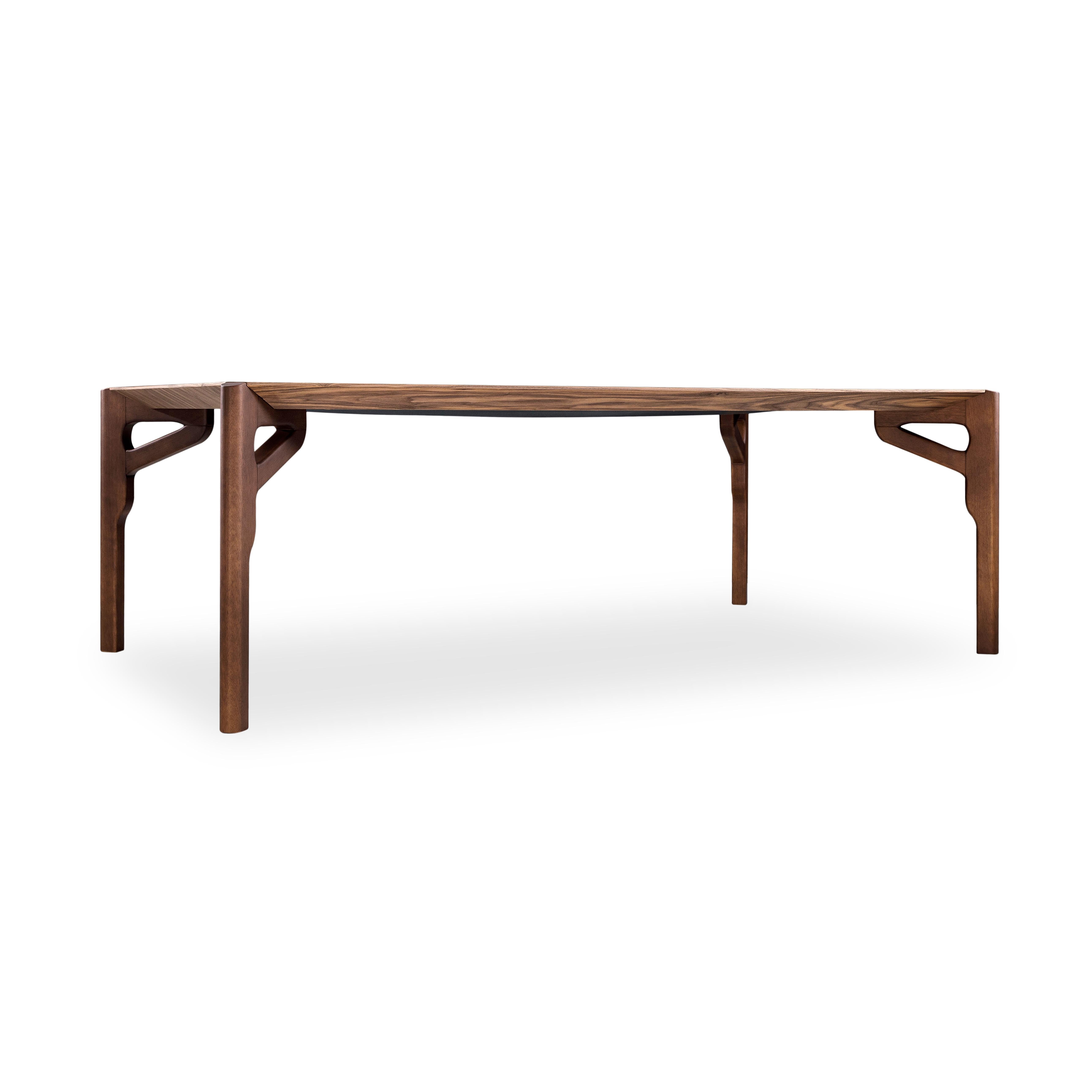 The Hawk dining table is a stunning centerpiece designed to bring modern sophistication and functionality to any dining space. *Please check availability prior to purchase*.

Featuring an expansive 86-inch walnut veneer tabletop with a rich walnut