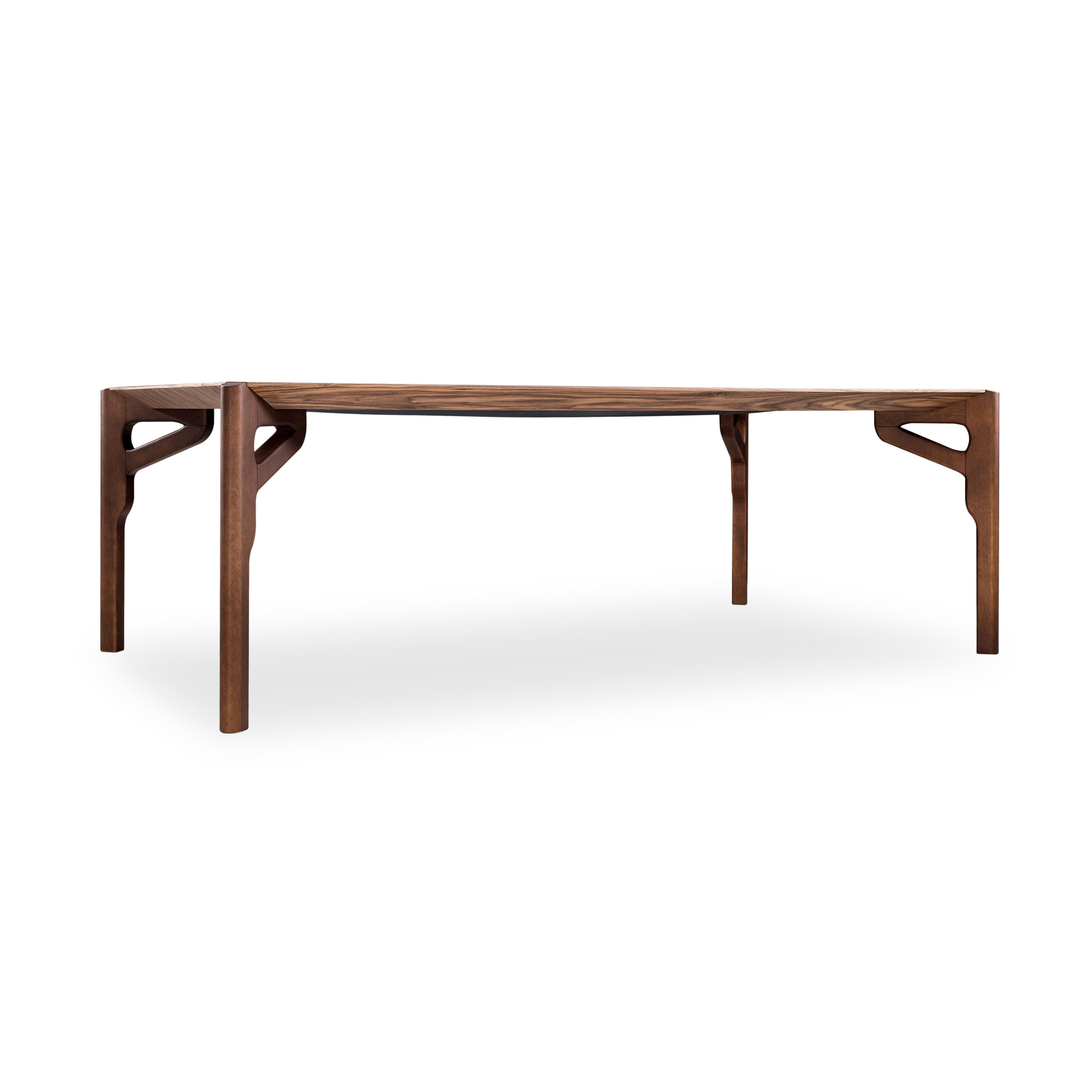 The Hawk dining table has been designed by our Uultis Design team with a walnut finish veneered table, the perfect addition to any dining room. It is a sophisticated table for modern contemporary decor, inspired by Brazilian culture. The large