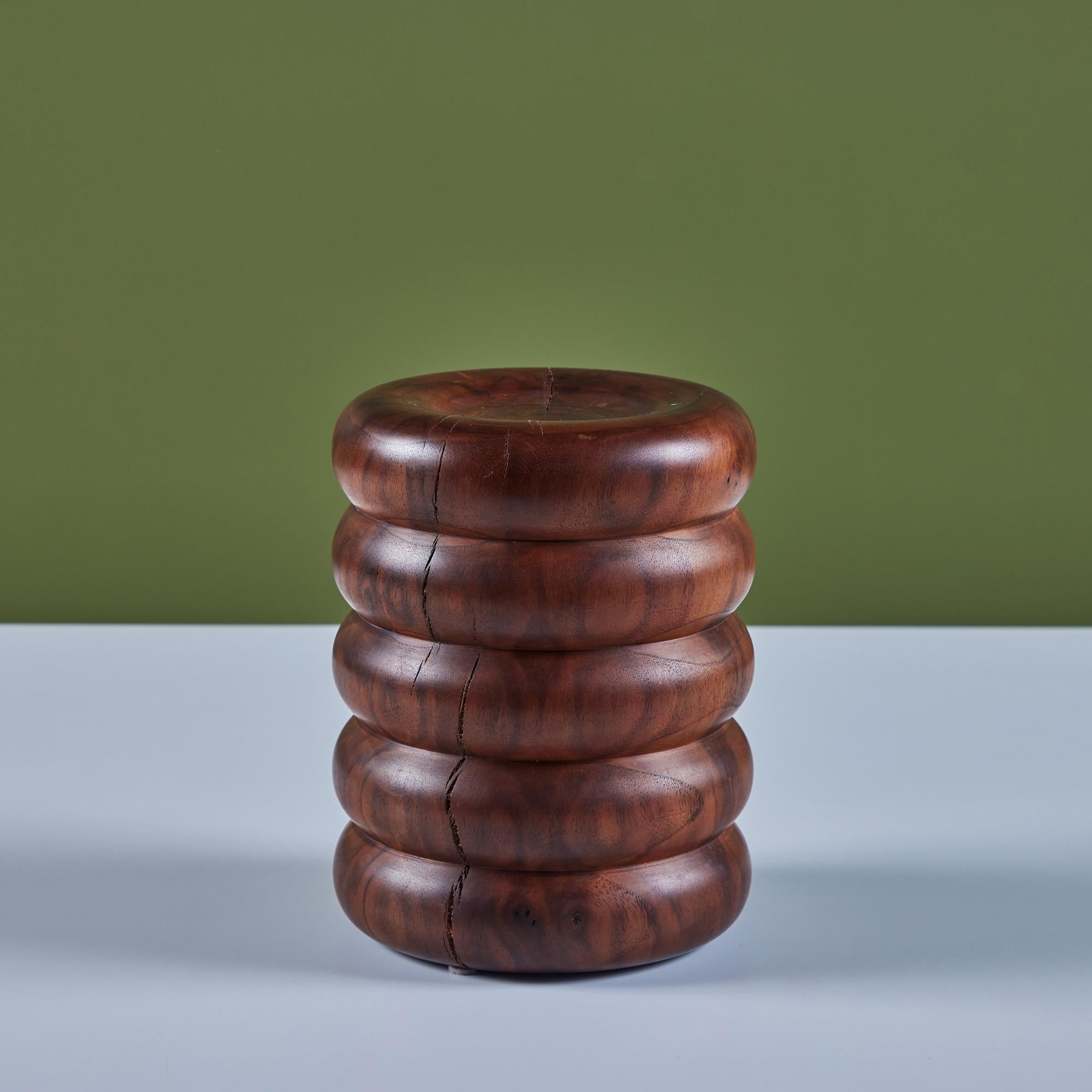 Hand turned claro walnut stand by contemporary Los Angeles designer, David O'Brien of Hawk & Stone. David's appreciation for nature and wood has deep roots back in New England. This small stand features a five tiered ribbed cylindrical