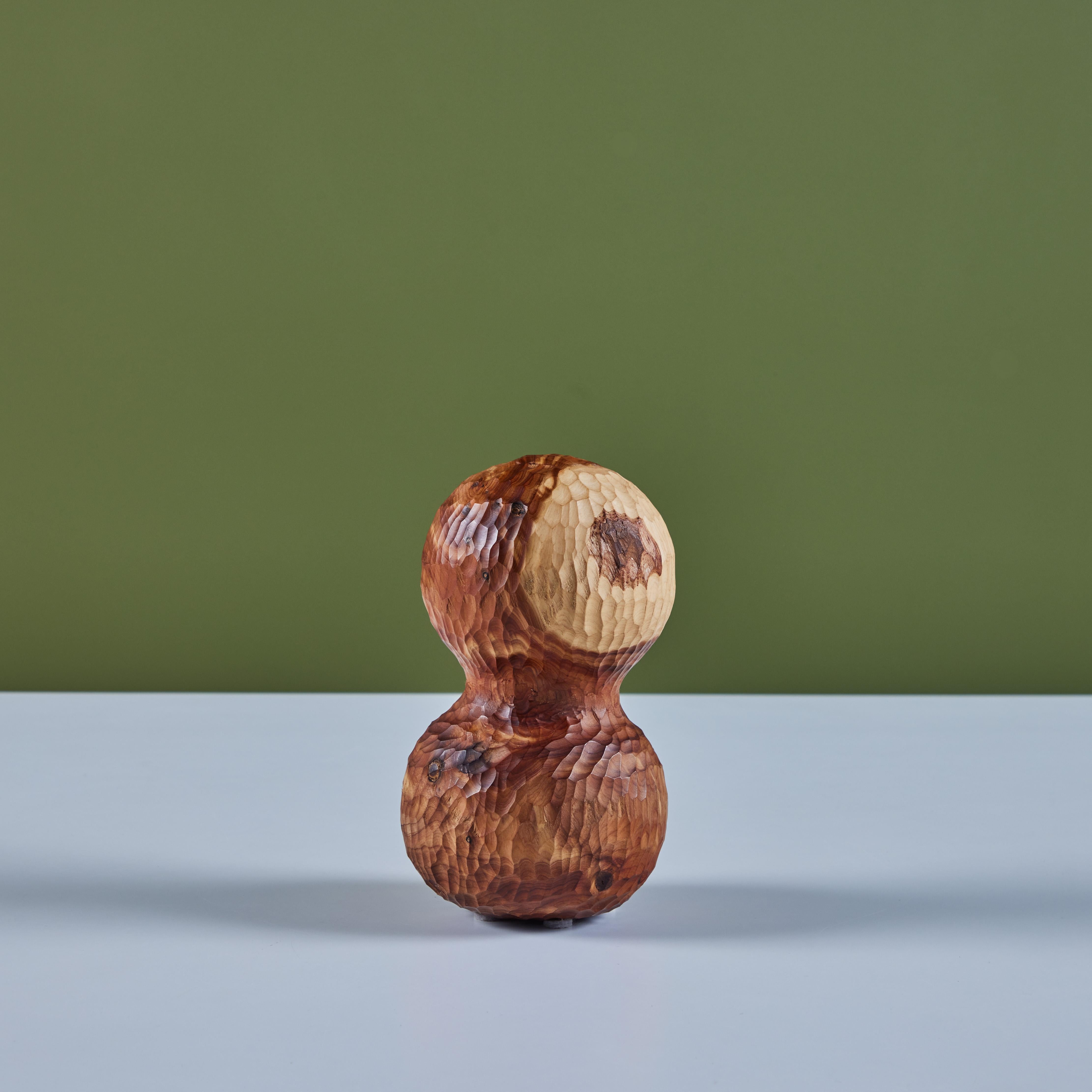 Hand carved juniper sculpture by contemporary Los Angeles designer, David O'Brien of Hawk & Stone. David's appreciation for nature and wood has deep roots back in New England. This sculpture features a two stacked spheres with textured hand carving