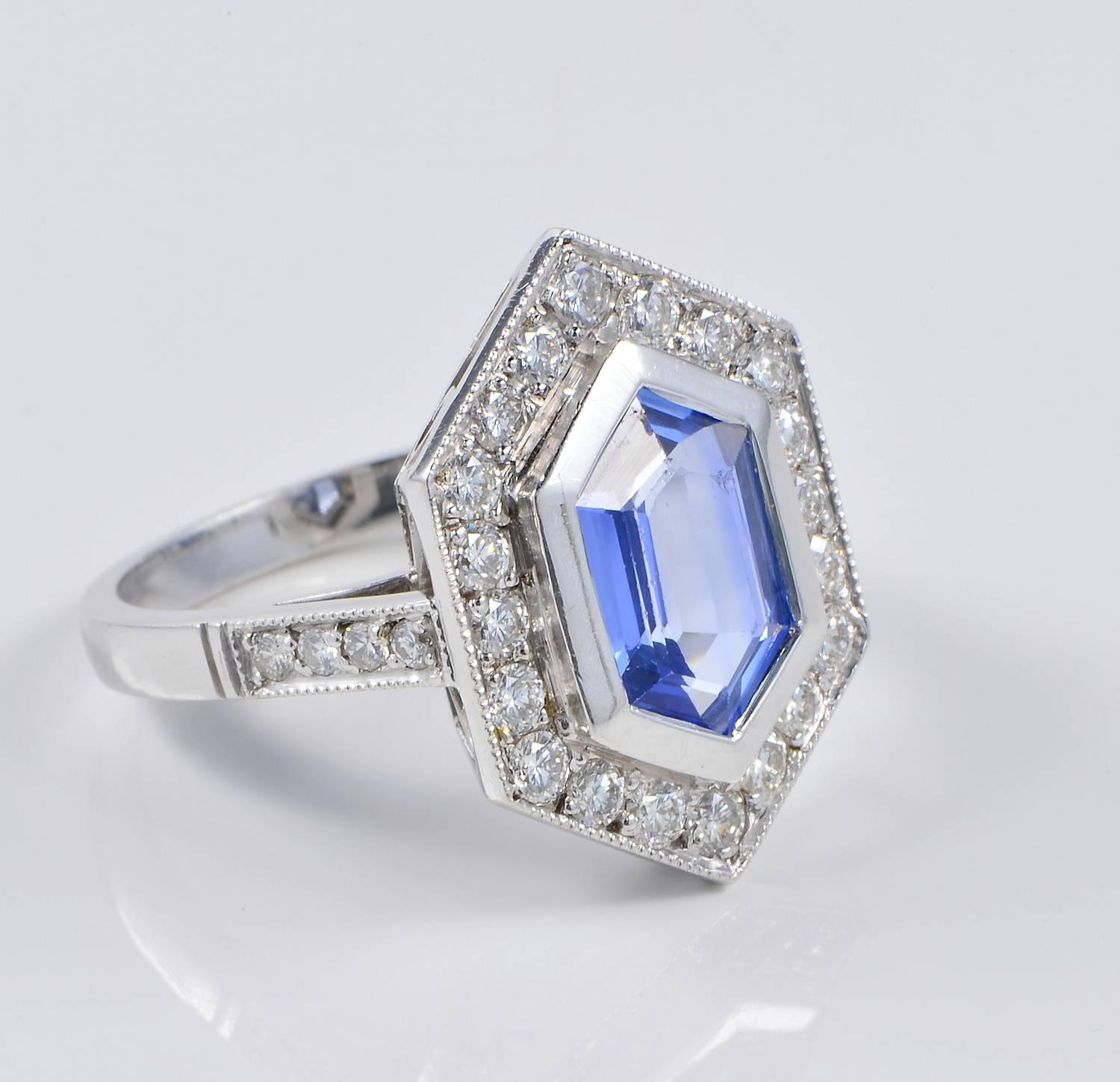 Priced down!

This  absolutely beautiful vintage ring dates 1960 ca
A truly knockout Natural Ceylon Sapphire no heat or treated in any way is the star of the crown, beautifully complemented with loads of Diamonds, combined with a one off designed
