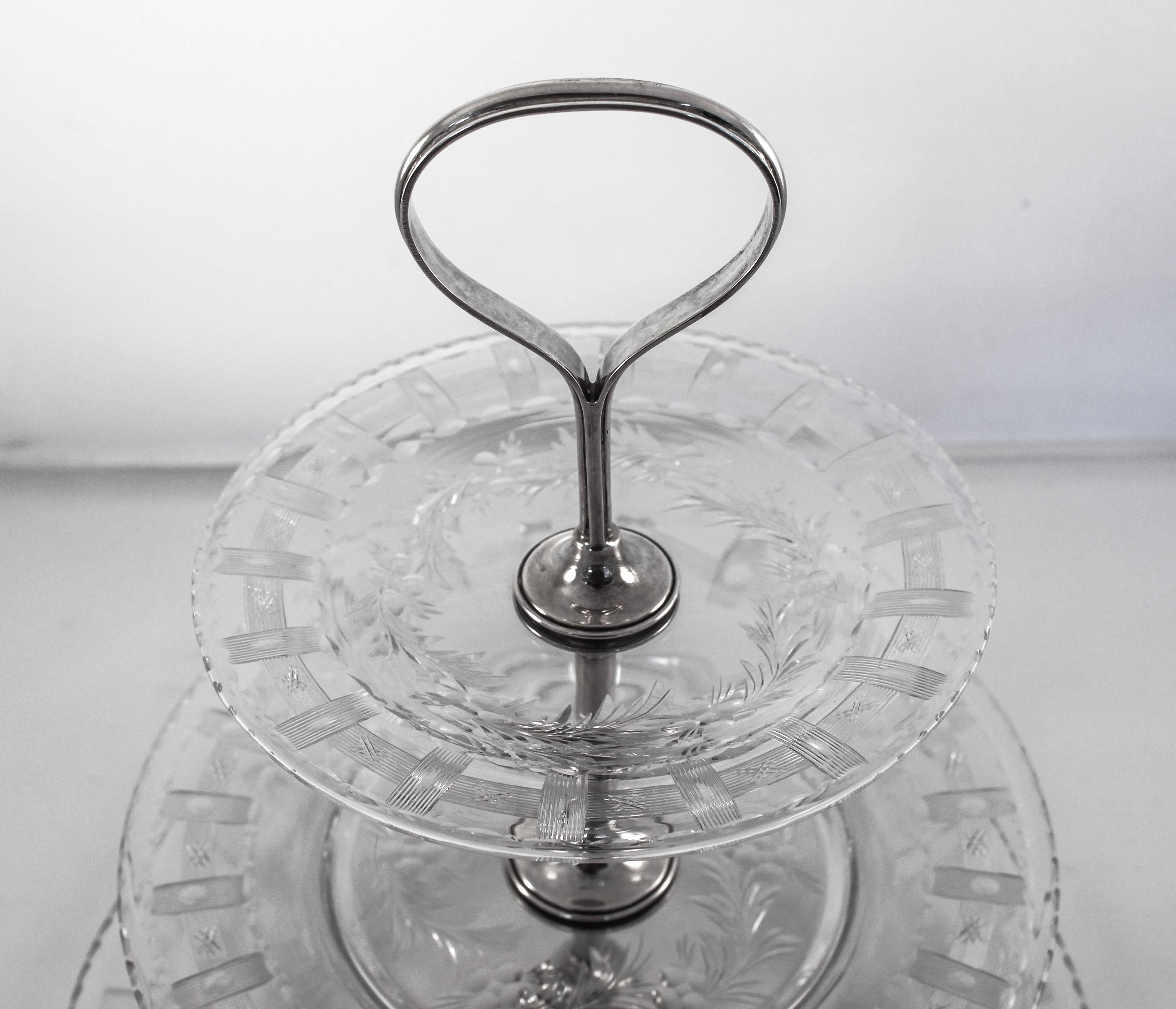 How amazing to find something this rare, in mint condition and almost one hundred years old!! This crystal and sterling 3-tier server is simply gorgeous. A sterling silver center rod and handle with three different sized plates attached. Each plate