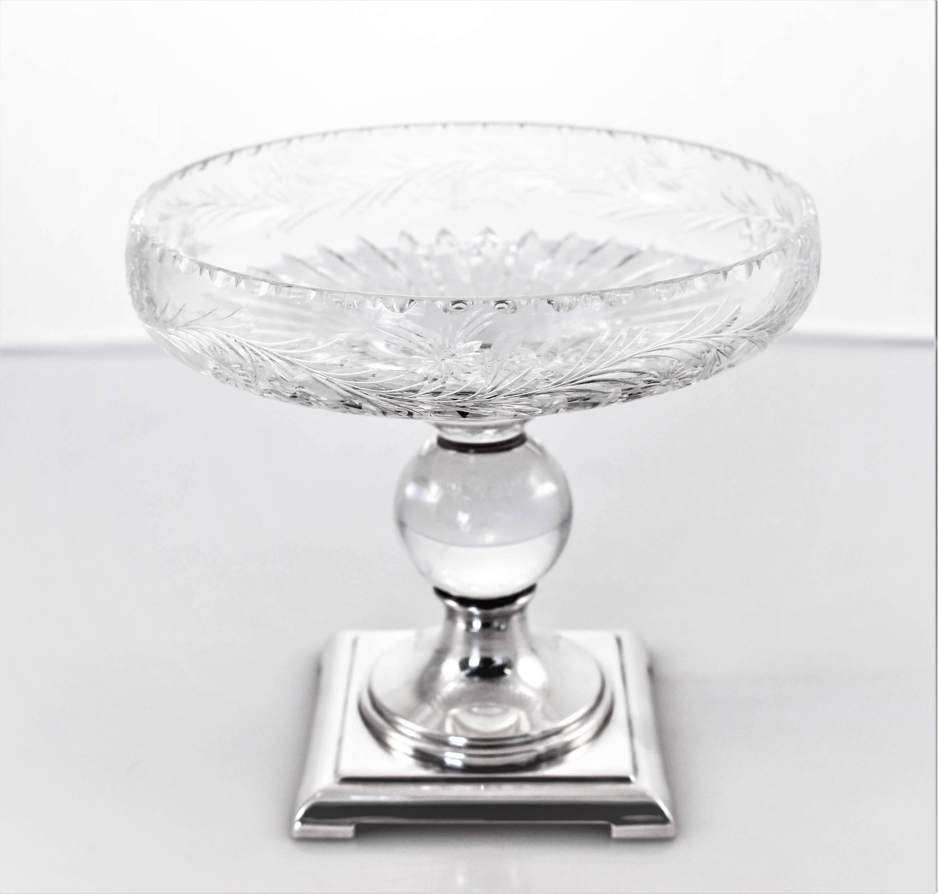 The Hawkes company was famous for manufacturing hollowware combining silver and crystal. Here we proudly offer a silver and crystal compote by Hawkes. Notice the cut glass (flowers and wreaths) around the entire circumference as well as the ridges