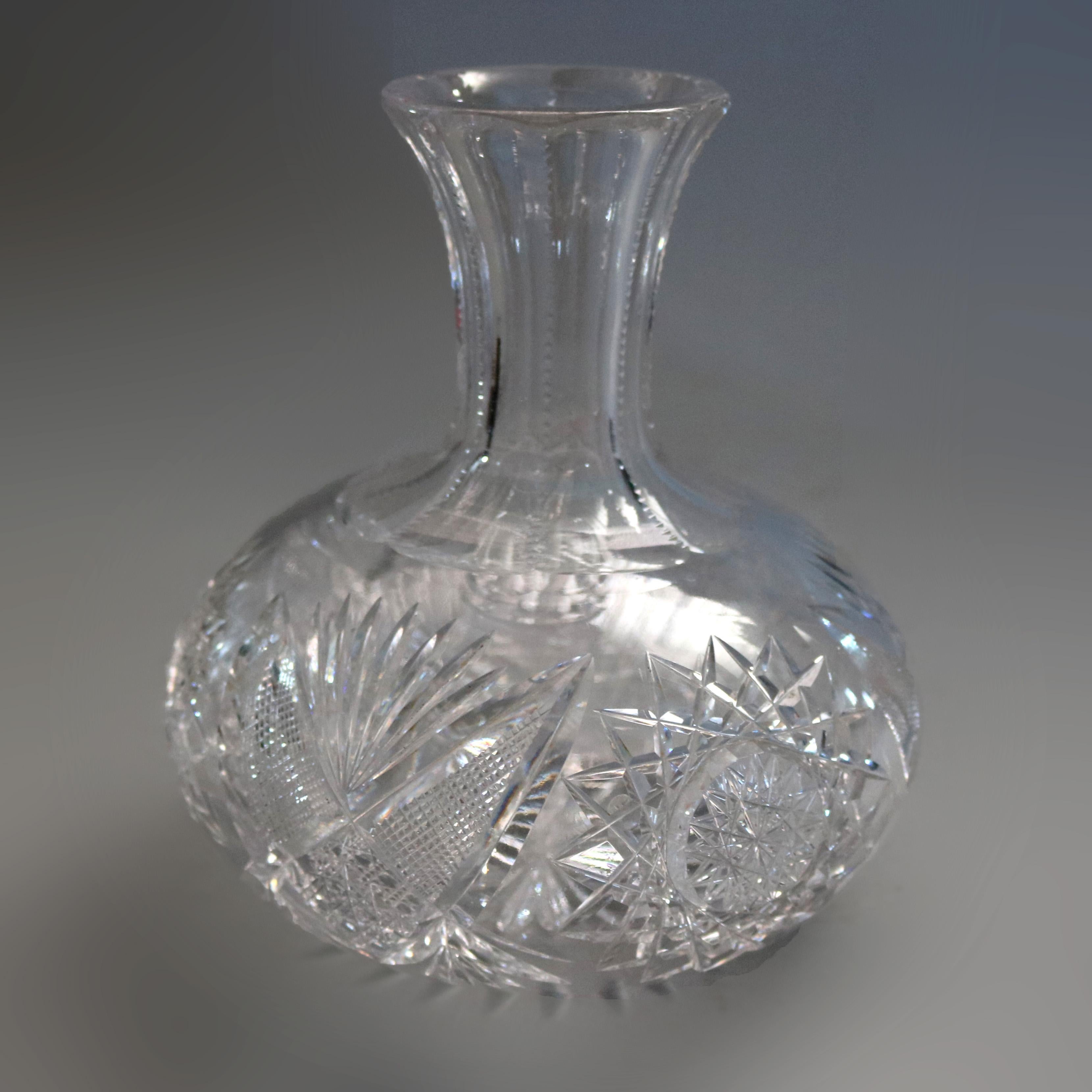 A Hawkes School American Brilliant Cut Glass wine carafe features squat cut crystal ball with ribbed neck terminating in flared mouth, 20th century.

Measures- 7.25