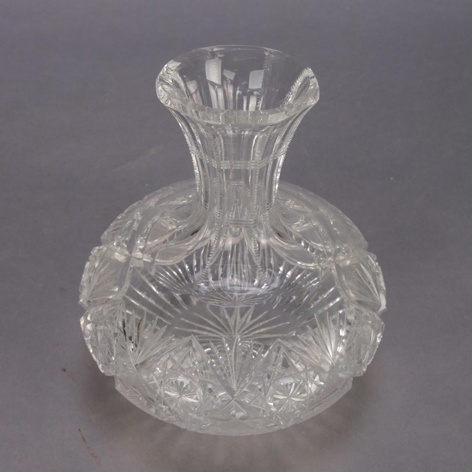 A Hawkes School American Brilliant Cut Glass wine carafe features squat cut crystal ball with ribbed neck terminating in flared mouth, 20th century.


Measures: 7.5