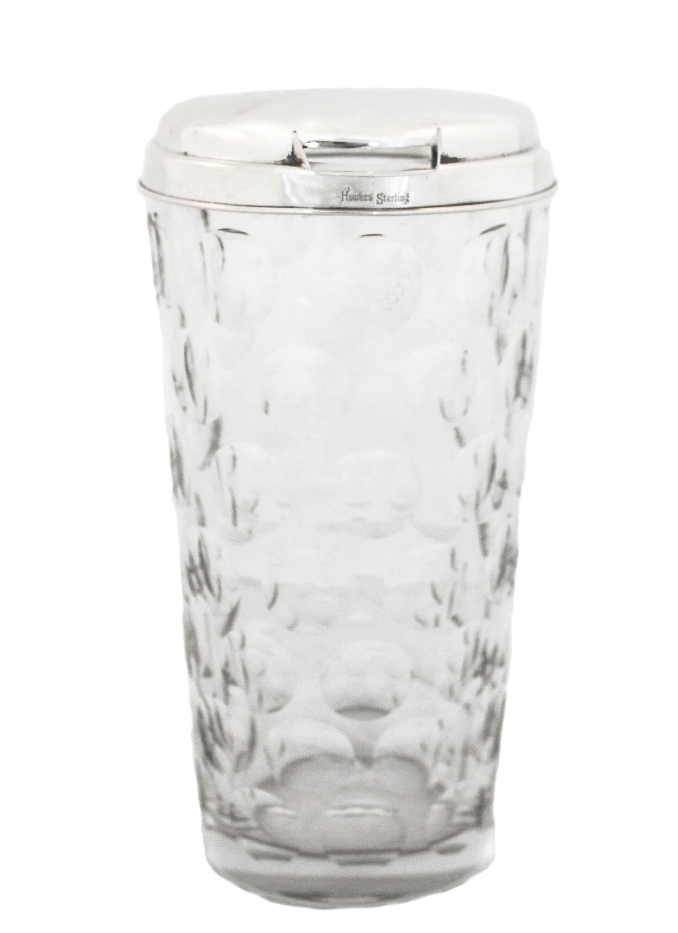 We are delighted to offer you this crystal and sterling silver cocktail shaker. Manufactured by the Hawkes Glass Company. Based in Corning, NY, T.G. Hawkes & Co. (c.1880-1959) was established by Thomas Gibbons Hawkes (1846-1913). Born in Ireland,