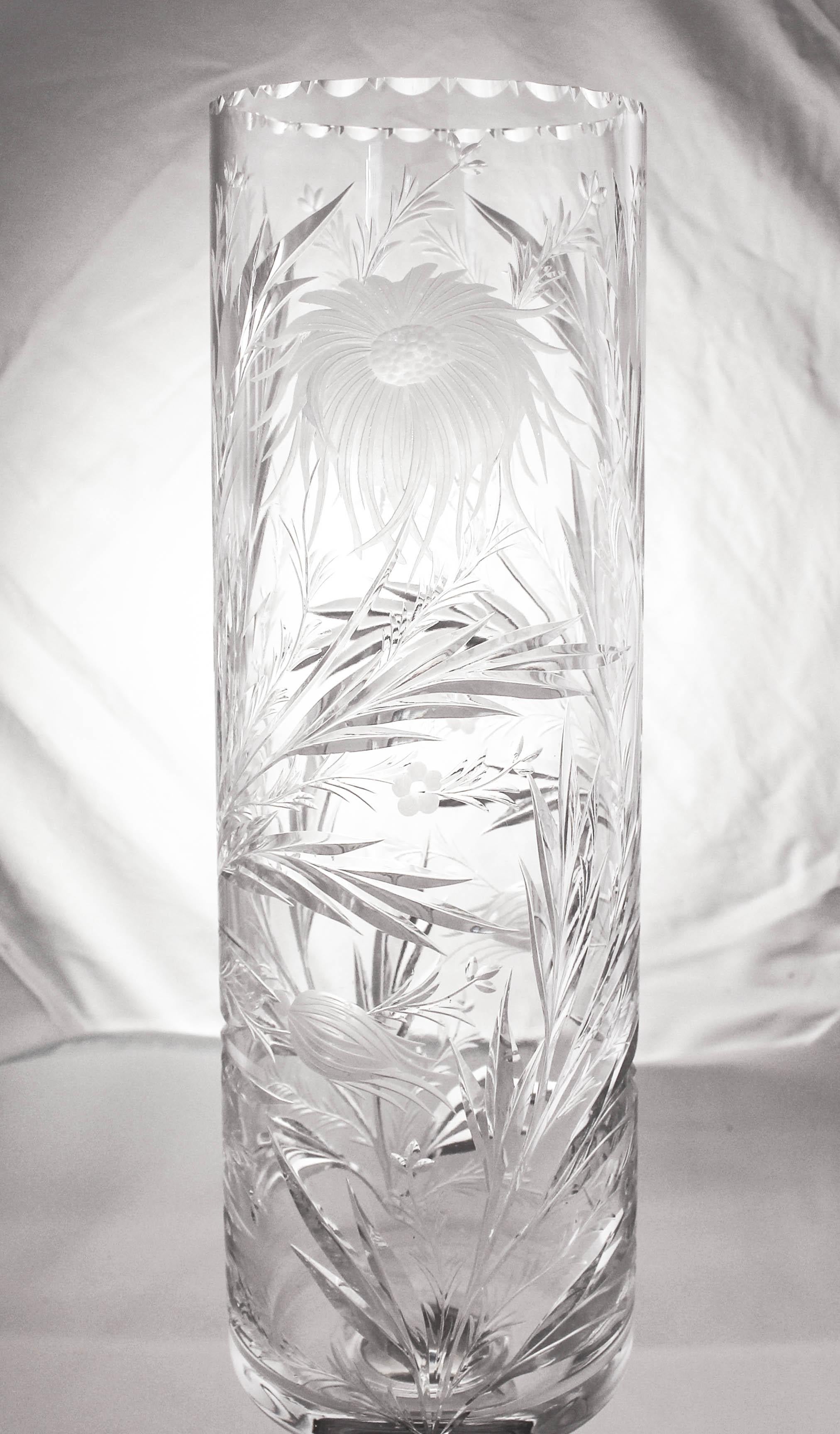 We proudly offer this stunning sterling and crystal vase by nine other than the world famous Hawkes Glass Company. Hawkes was the premiere crystal manufacturer at the turn of the 19th century. This vase has acid-etched and cut-glass flowers and