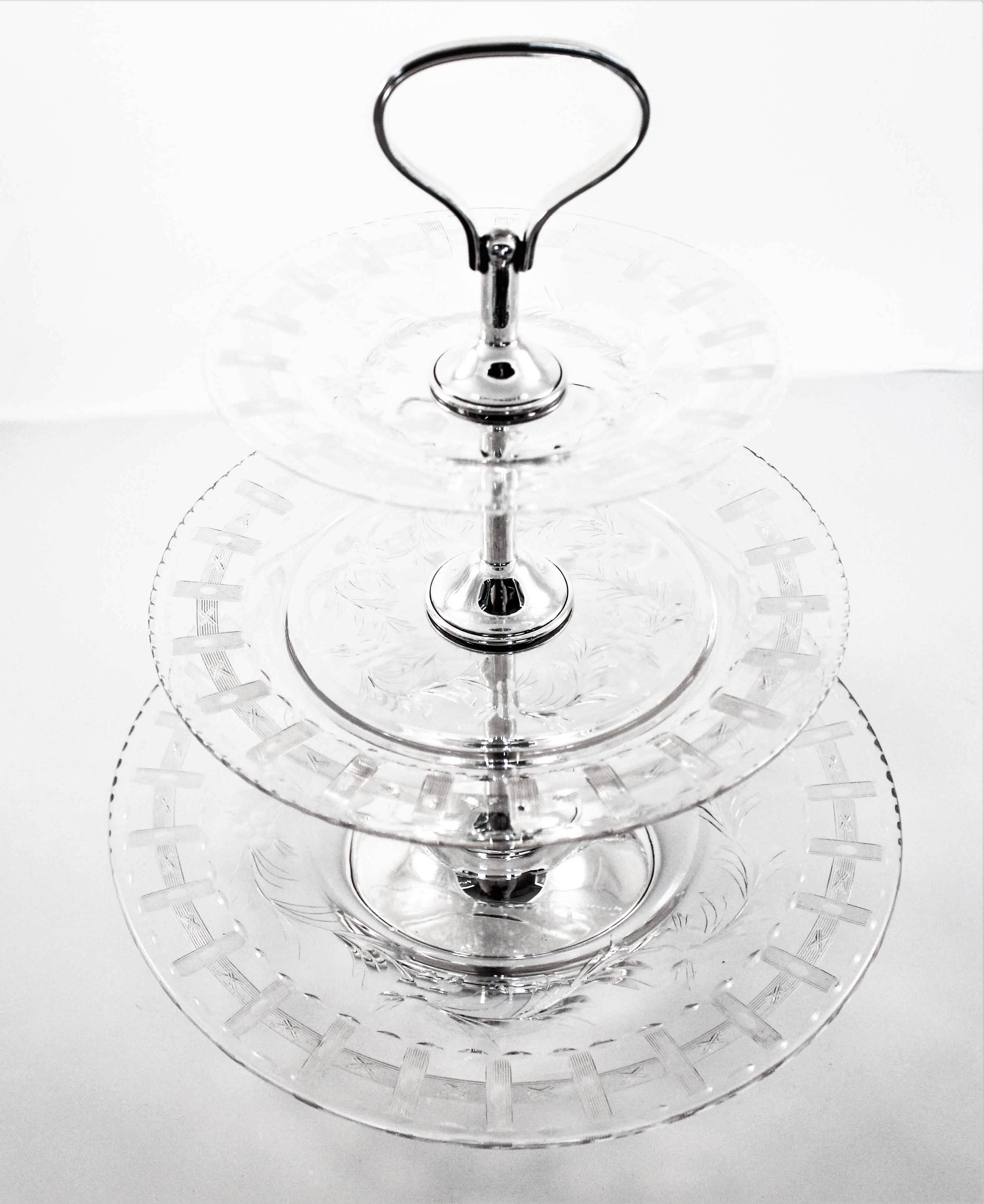 A spectacular example of Hawkes crystal and sterling hollowware. This three-tier piece is the perfect accessory for entertaining. Whether filled with hors d’oeuvres or desserts this treasure will be the center of attraction. The three crystal dishes