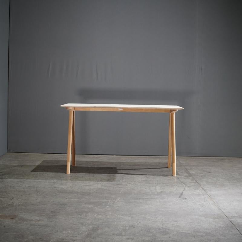 The Hay CPH 90 Copenhague White Desk is a testament to the sleek and functional design sensibilities of Ronan & Erwan Bouroullec. With its refined silhouette and minimalist aesthetic, this desk is crafted from durable oak and finished with a chic