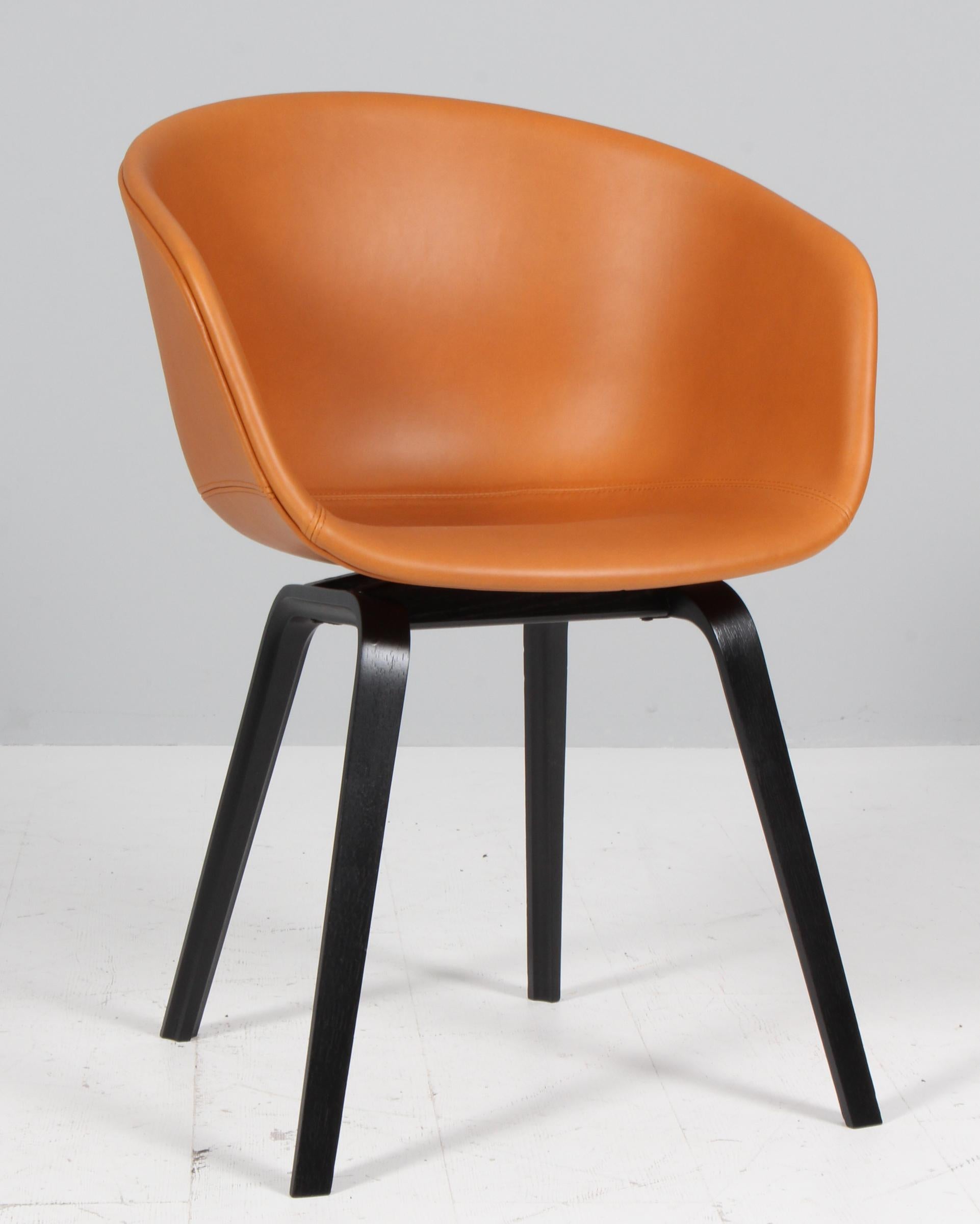 Hay AAC22 dining chairs in black leather with black stained ash legs. 