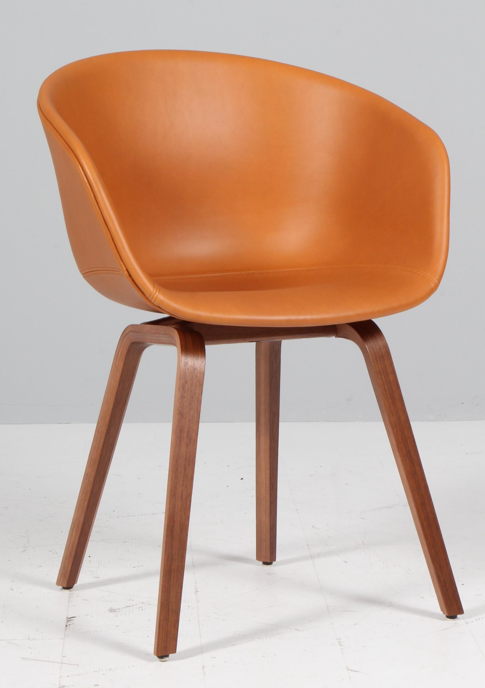 Hay AAC22 dining chairs in cognac silk aniline leather with walnut legs. 