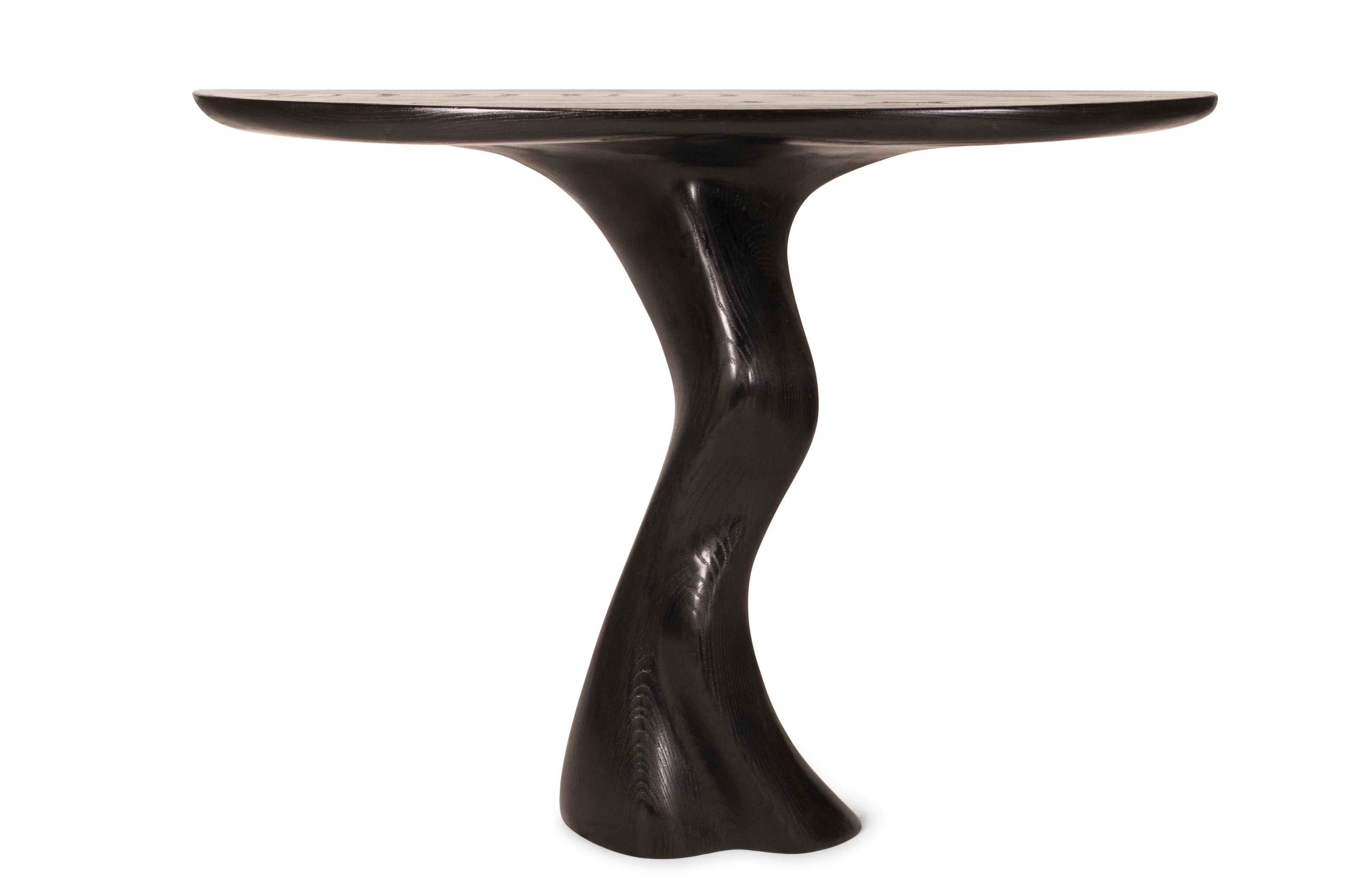 Haya console table is a stylish futuristic sculptural art table with a organic form designed and manufactured by Amorph. Haya console table is made out of solid wood and stained. 
The dimension of the piece can be modified upon your request.

About