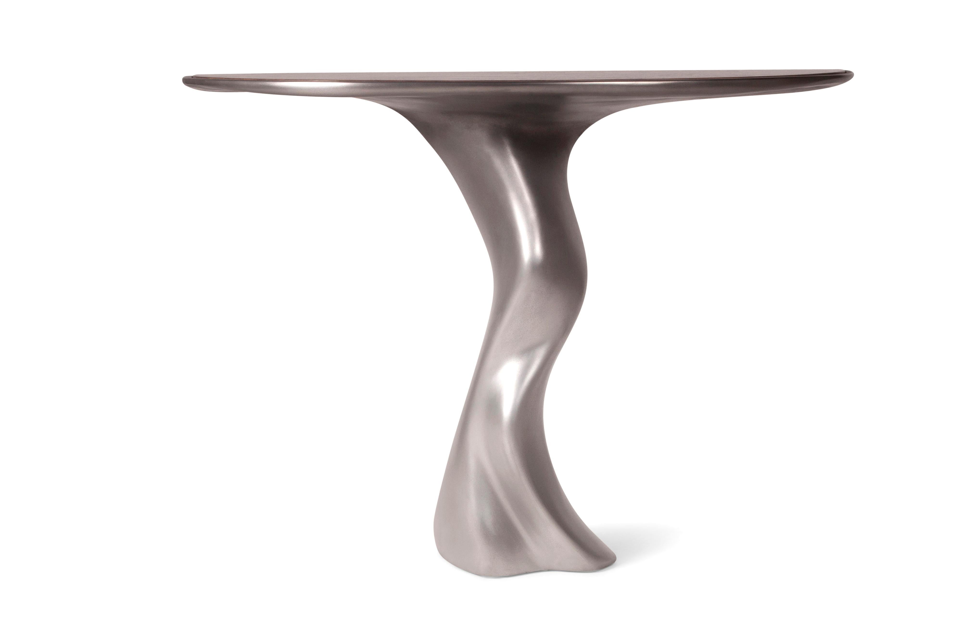 Haya console table is a stylish futuristic sculptural art table with a organic form designed and manufactured by Amorph. Haya console table is made out of wMDF with stainless steel finished.
The dimension of the piece can be modified upon your