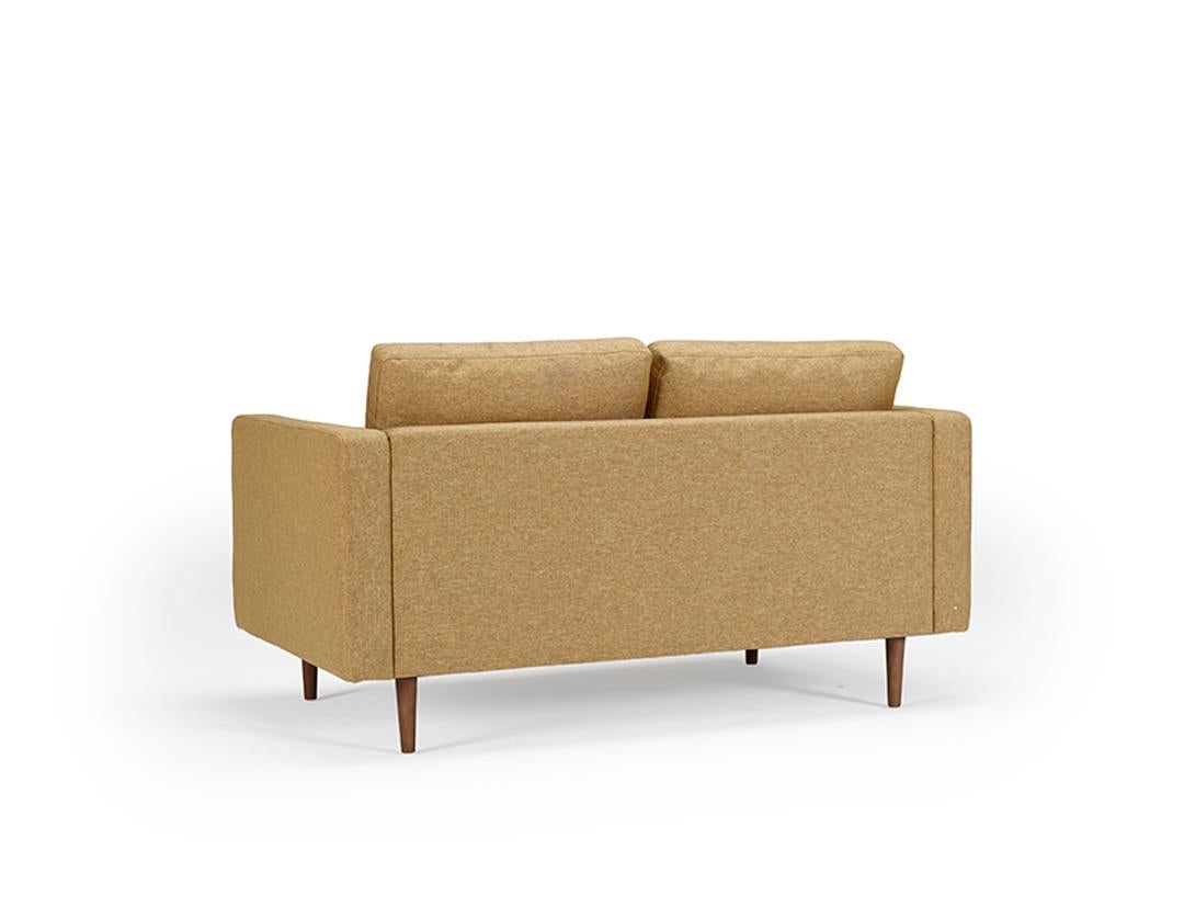 Echoing the timeless appeal of mid-century Scandinavian design, the Clasico 2 Seater Sofa brings together comfort and style. This OEM piece offers customization with various wood finishes for the legs and an array of fabric or leather options for