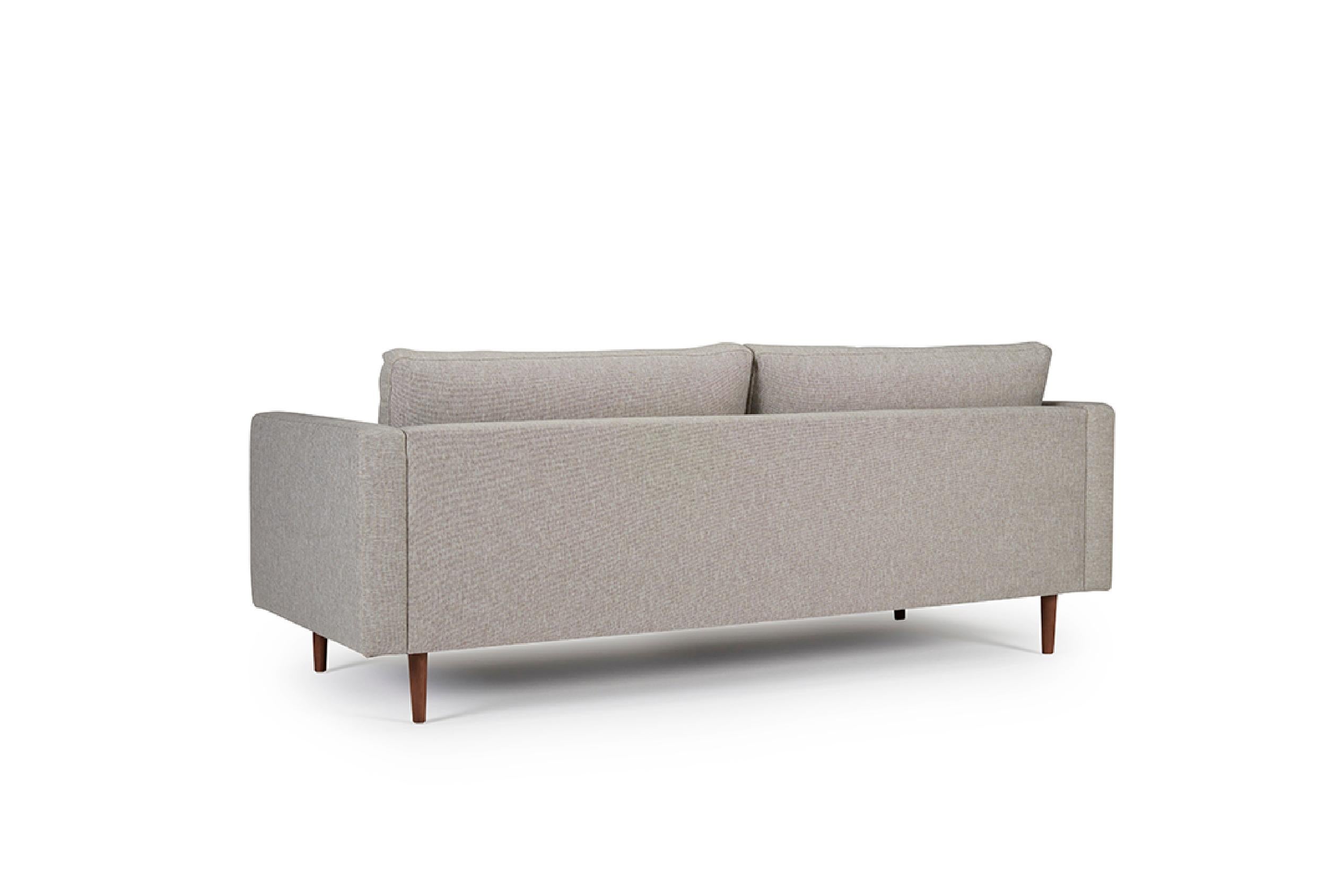 Channeling a classic mid-century Scandinavian modern design, the Clasico 3 Seater Sofa effortlessly combines timeless aesthetics and contemporary comfort. As an OEM product, it presents various wood finishes for the legs and a selection of fabric or