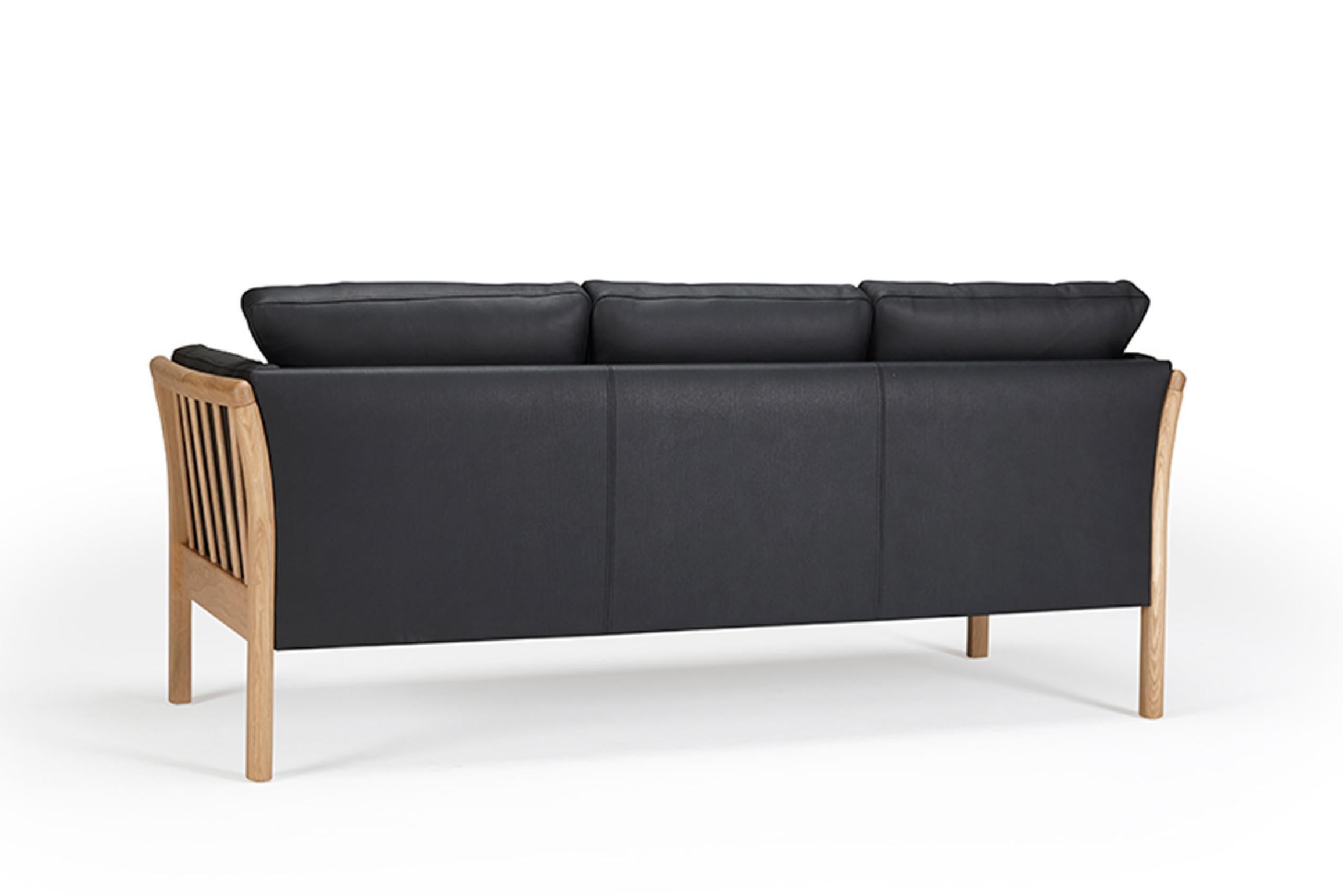 The Oscar 3 Seater Sofa captures the essence of classic mid-century Scandinavian modern design. This OEM product offers a range of wood finishes for the legs and a variety of fabric or leather upholstery options. Crafted with comfort in mind, it