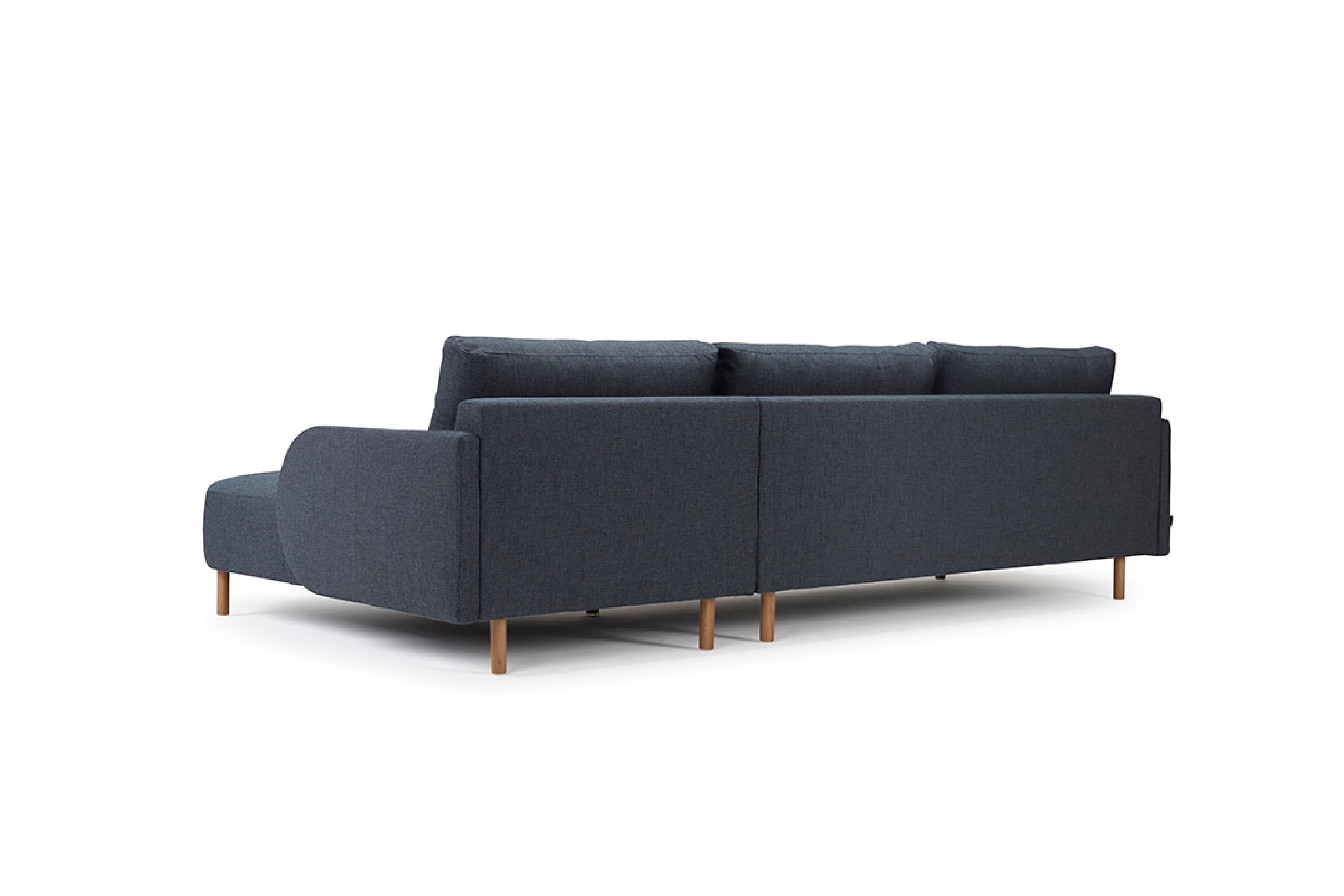 The Paleta Chaise+2 Sofa seamlessly blends clean, gentle contours with a modern design aesthetic. This OEM product presents options for black metal or oak lacquered legs, which harmonize with an array of fabric or wool upholstery finishes. Designed