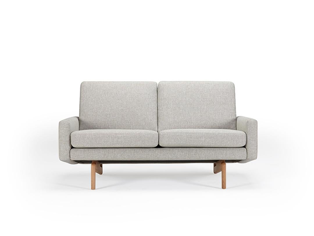 The Retro 2 Seater Sofa celebrates a timeline of British and Scandinavian upholstery design. Straddling a decade period from 1960 through to 1970 we can position this sofa and its aesthetic clearly within the era. However functionality and