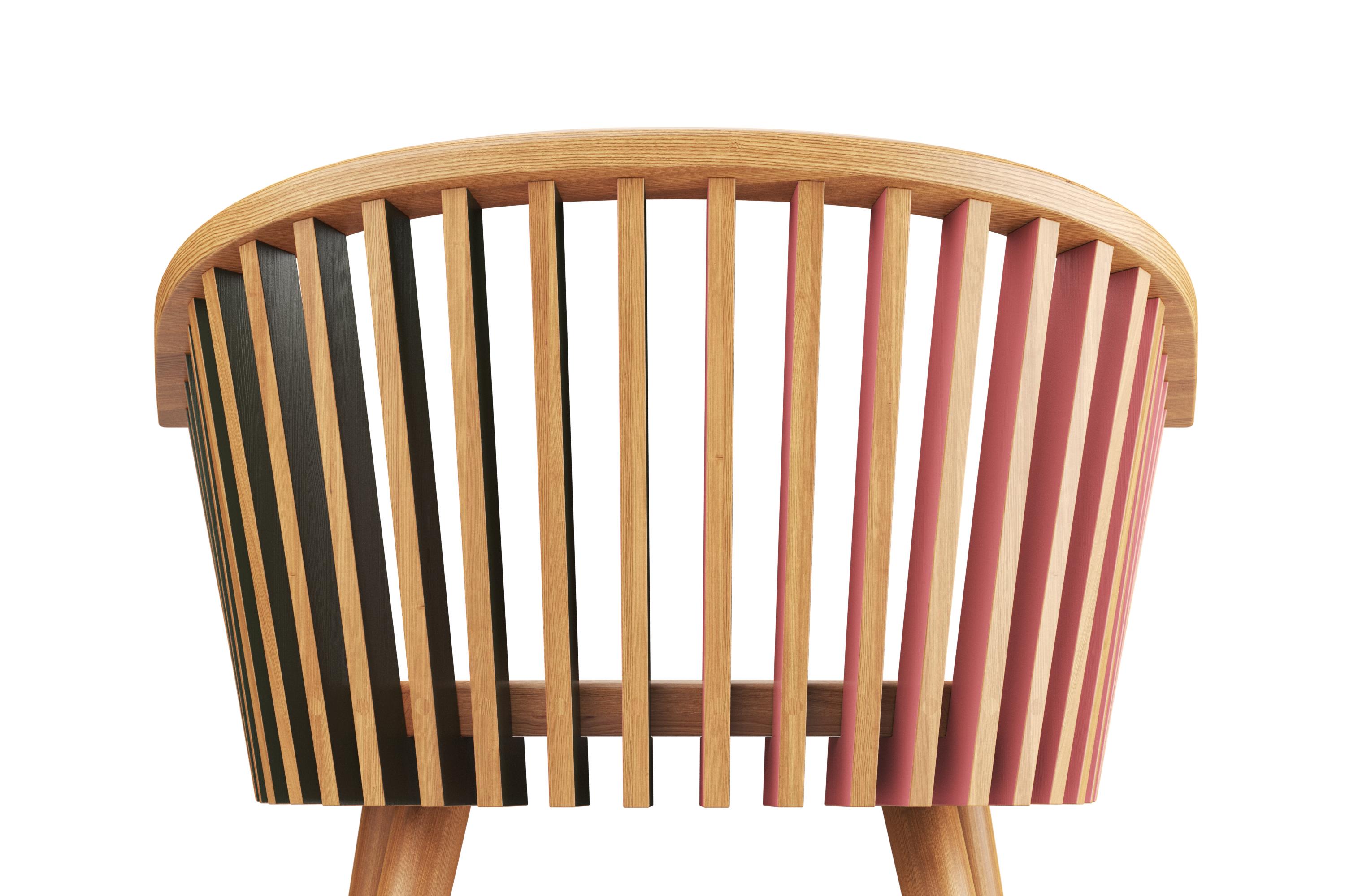 The Tornasol Rounded Chair takes a fresh approach to the solid oak chair, featuring an inviting curved wooden backrest crafted from several flat solid wood components. Each component displays a different color on opposing sides, adding a sense of