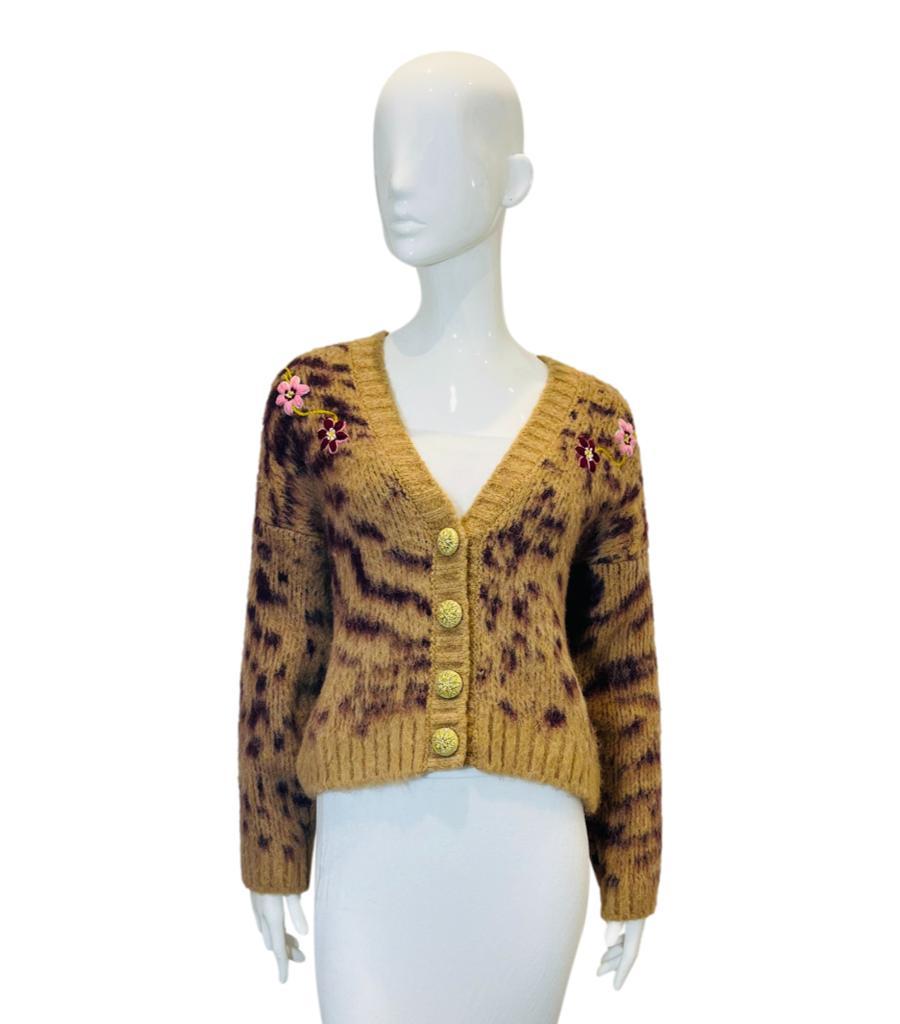 Hayley Menzies Alpaca & Wool Blend Cardigan
Camel brown cardigan designed with animal pattern and hand-embroidered with multicoloured flowers.
Detailed with macrame-style crochet gold buttons, V-Neckline and hip length. Rrp £380
Size – S
Condition –