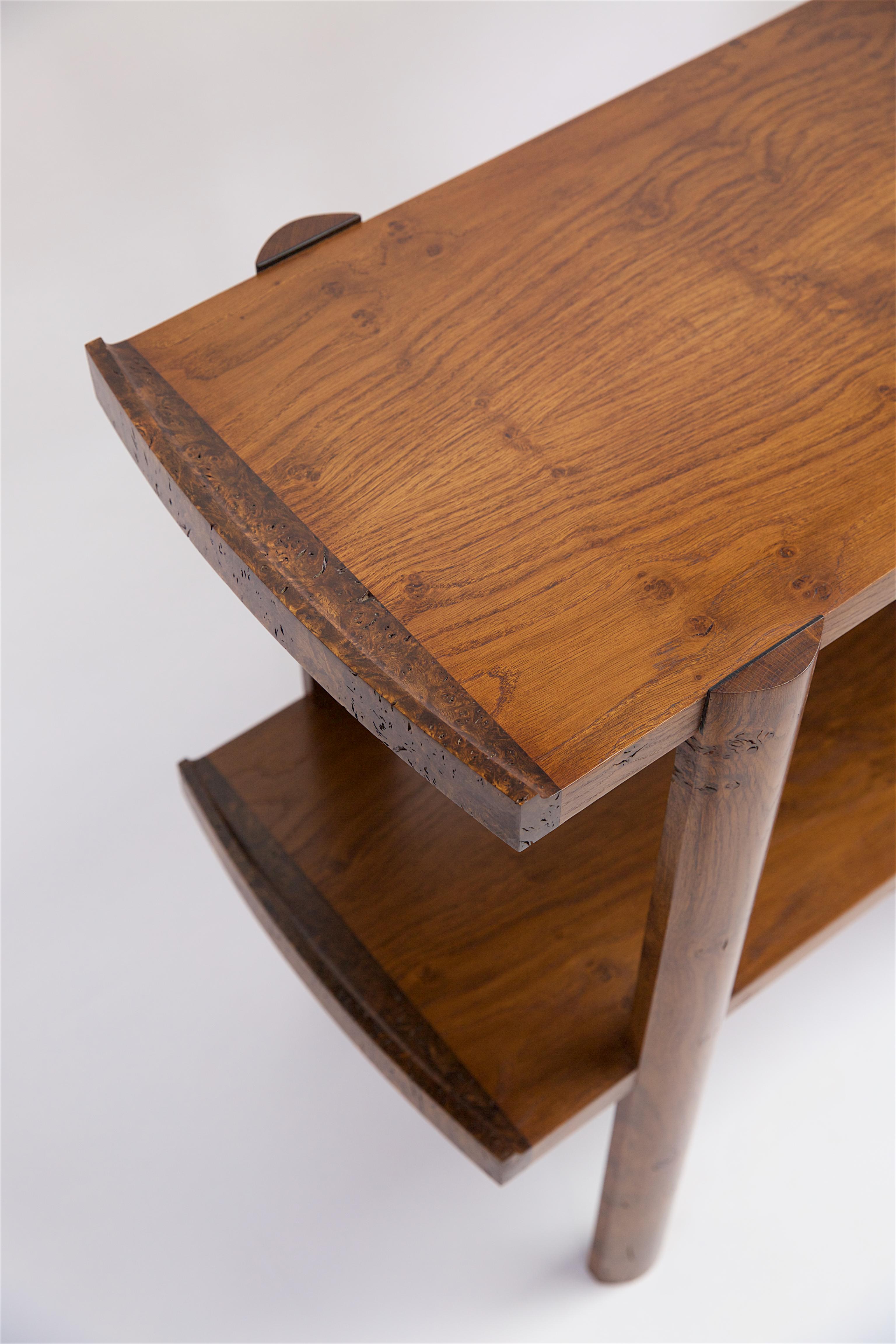 A super practical table in brown oak with dramatic burl / knot sections. Made from 600 year old English oak with some extraordinary burl sections in the legs and lipped edges. Lightly fumed to balance all the tones together and the lipped edges